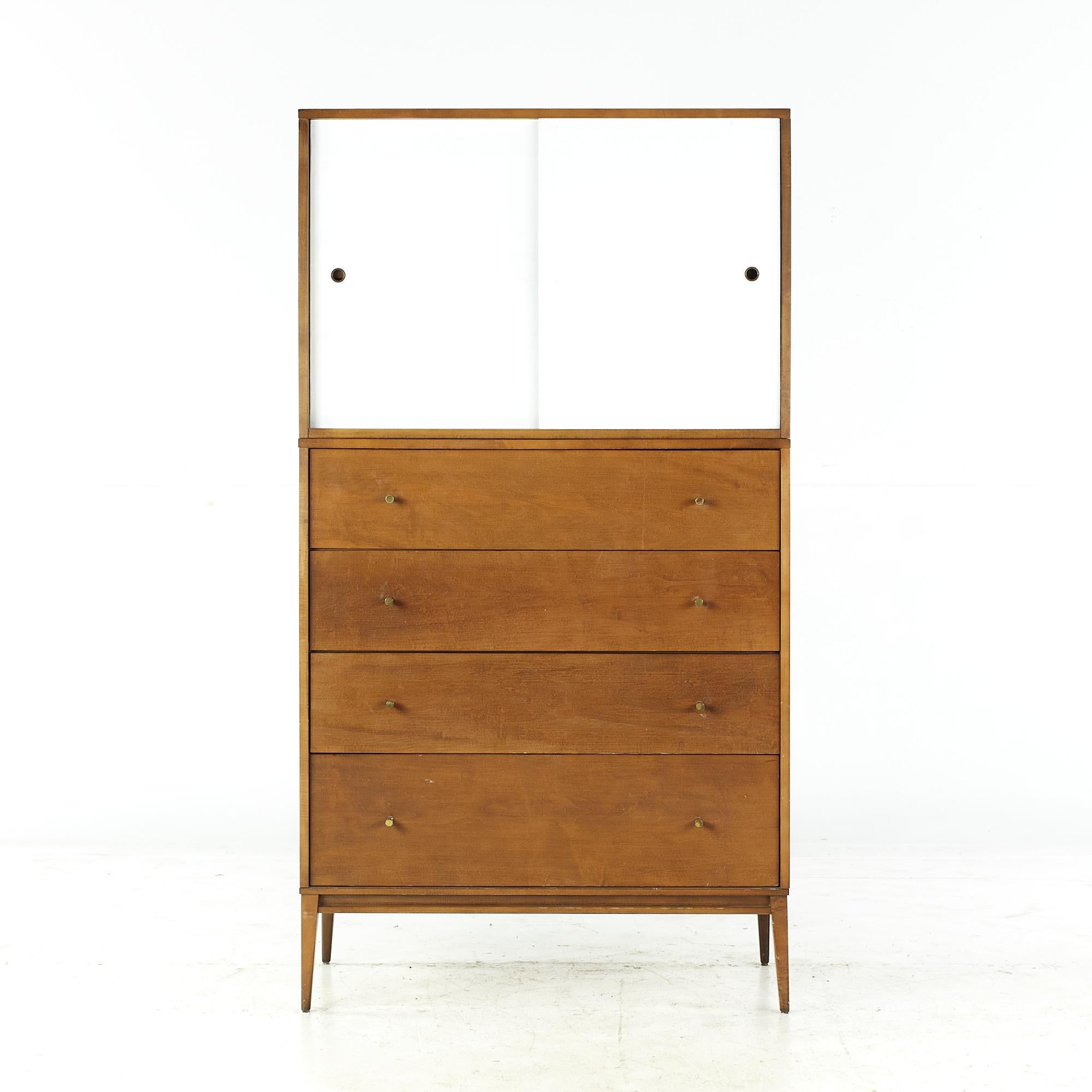 Paul McCobb planner group midcentury 4-drawer dresser with sliding door cabinet.

The bottom measures: 36 wide x 18 deep x 42.25 inches high.
The top measures: 36 wide x 18 deep x 24.25 inches high.
The combined height of the buffet and hutch is