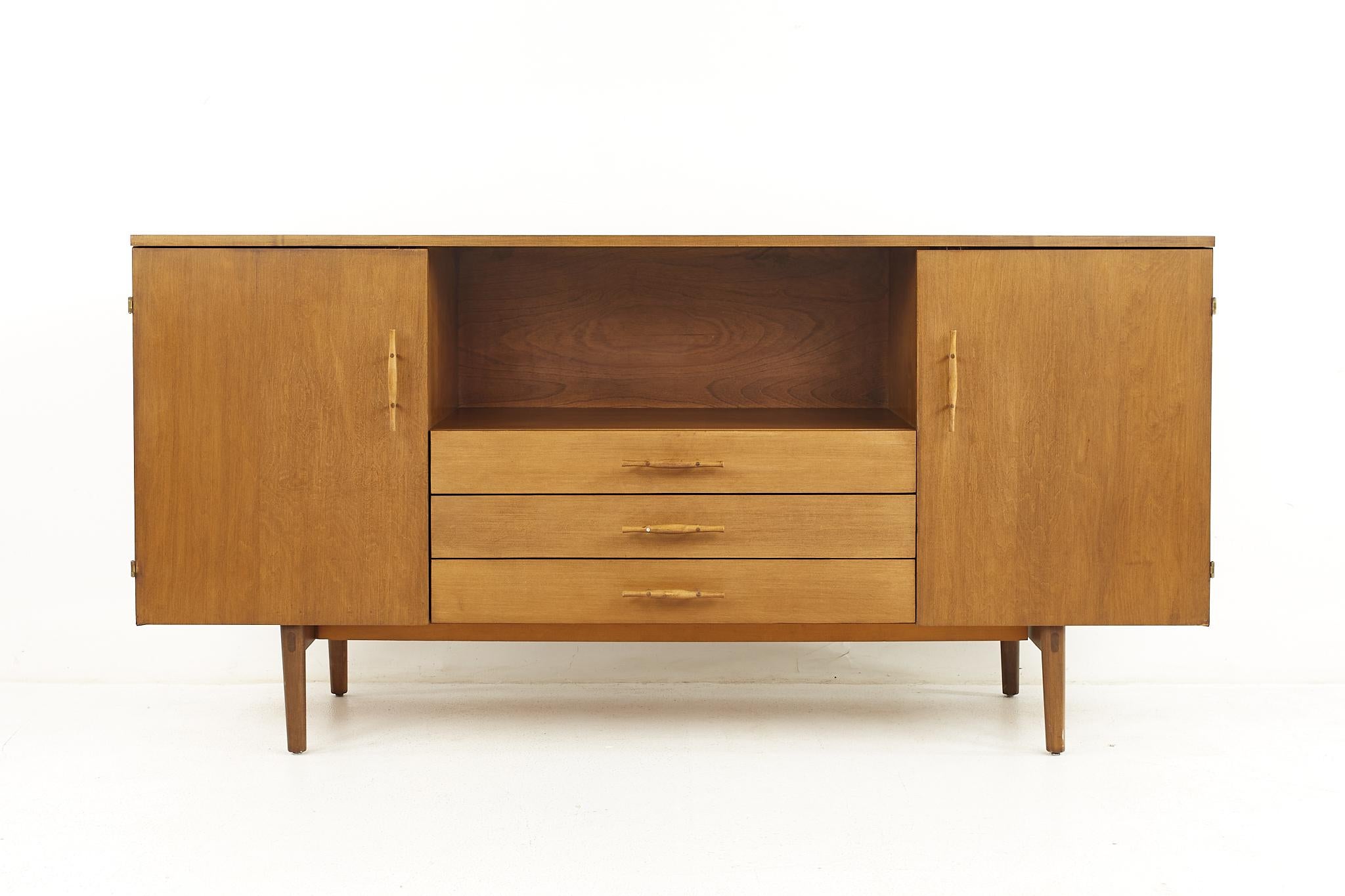 Paul McCobb Planner Group Mid Century Credenza

This credenza measures: 48 wide x 12 deep x 24 inches high

All pieces of furniture can be had in what we call restored vintage condition. That means the piece is restored upon purchase so it’s free of