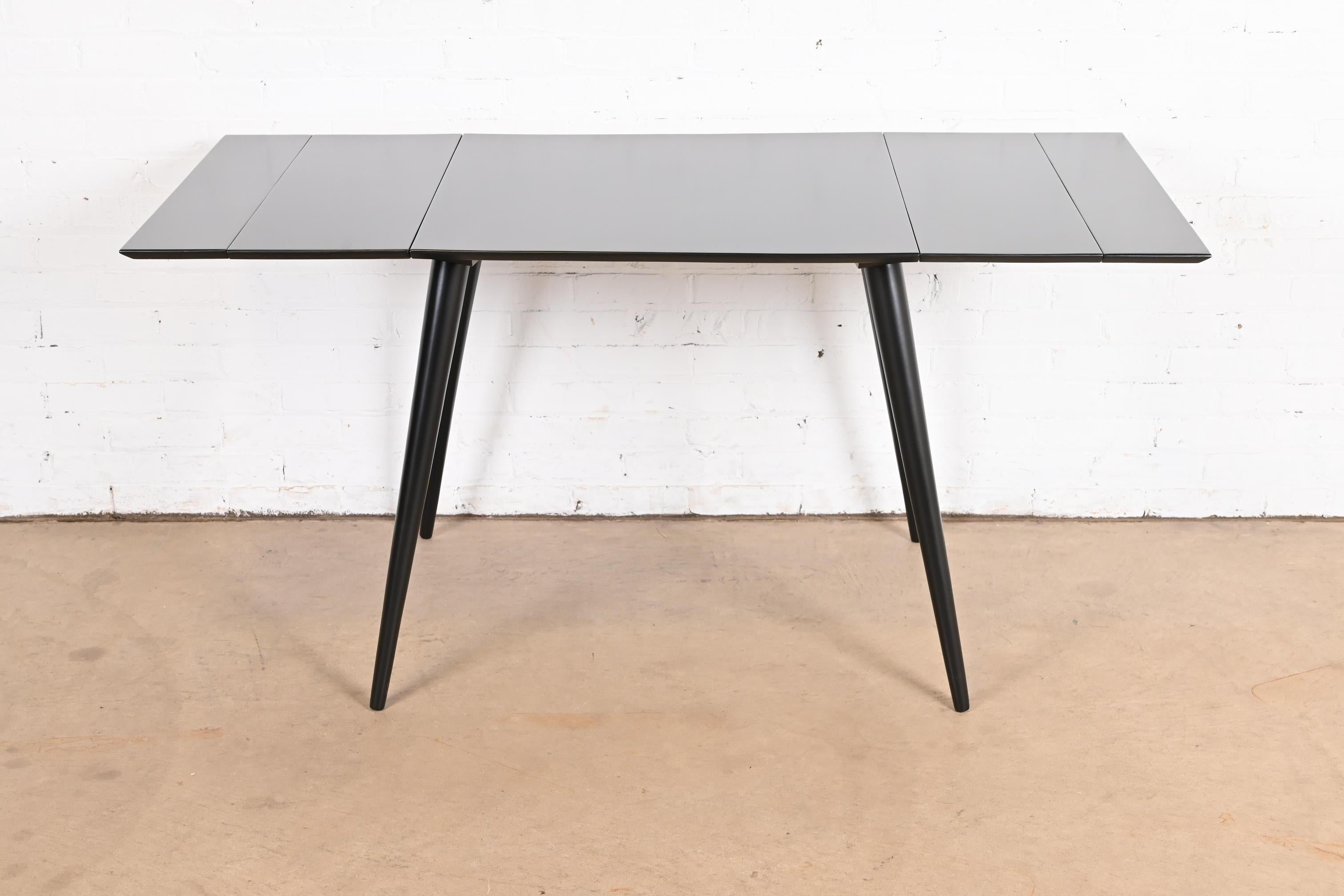 A sleek and stylish Mid-Century Modern extension dinette table or game table

By Paul McCobb for Winchendon Furniture, 