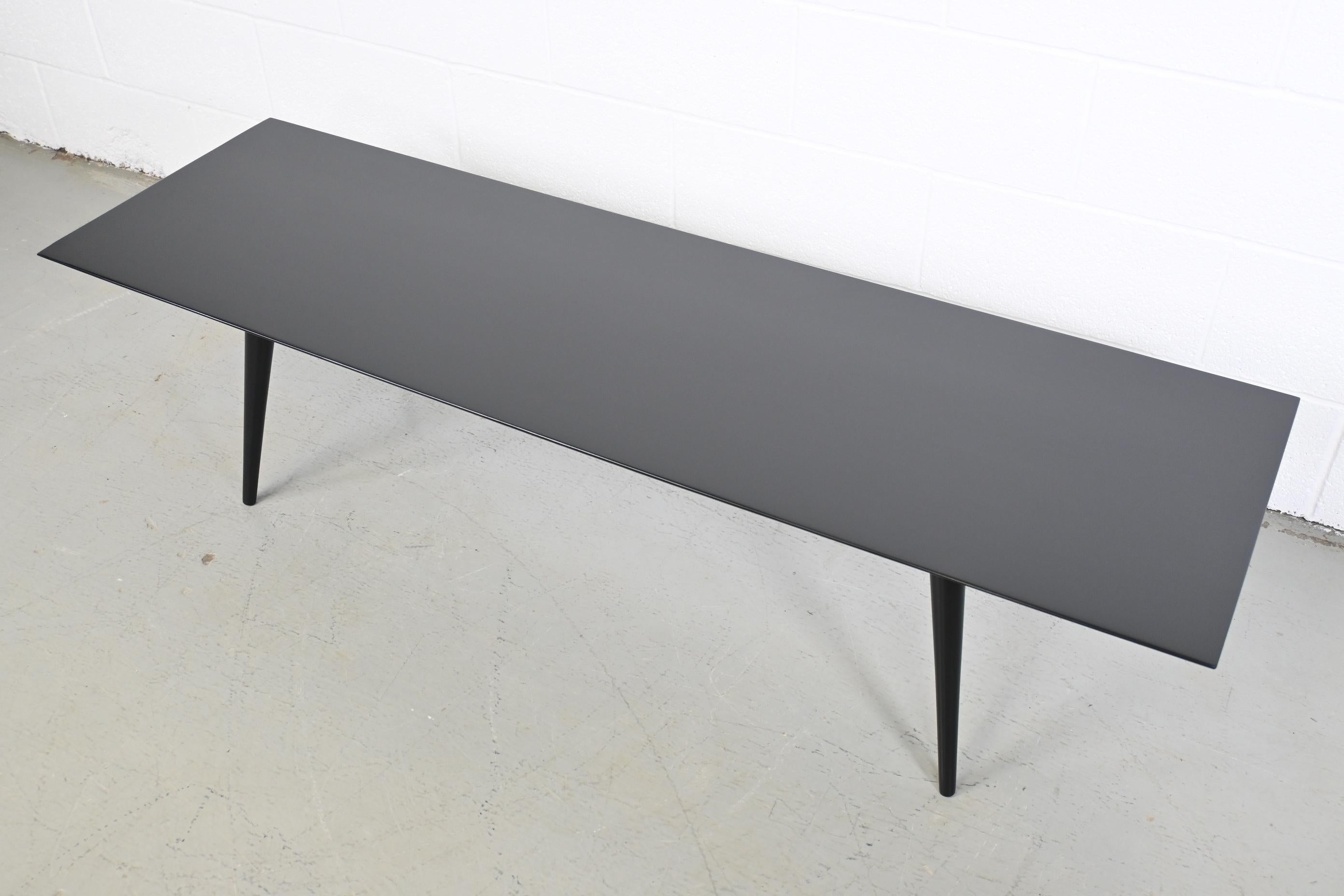Paul McCobb Planner Group for Winchendon Furniture Mid Century Modern Black Lacquered Coffee Table

Winchendon Furniture, USA, 1950s

60 Wide x 18 Deep x 14.75 High

Solid birch mid century modern black lacquered coffee