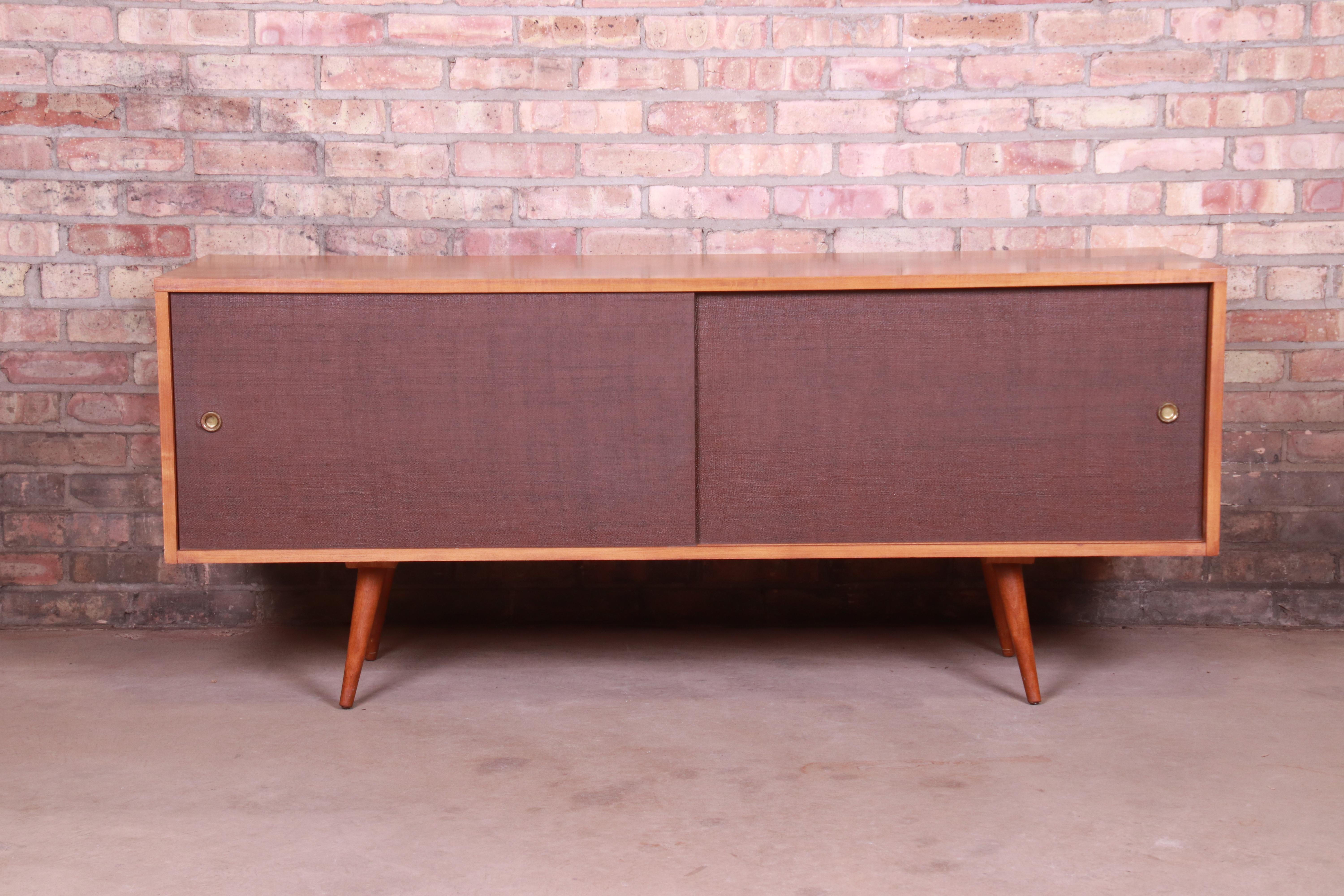 An exceptional Minimalist Mid-Century Modern sliding door credenza or record cabinet

By Paul McCobb for Winchendon Furniture 