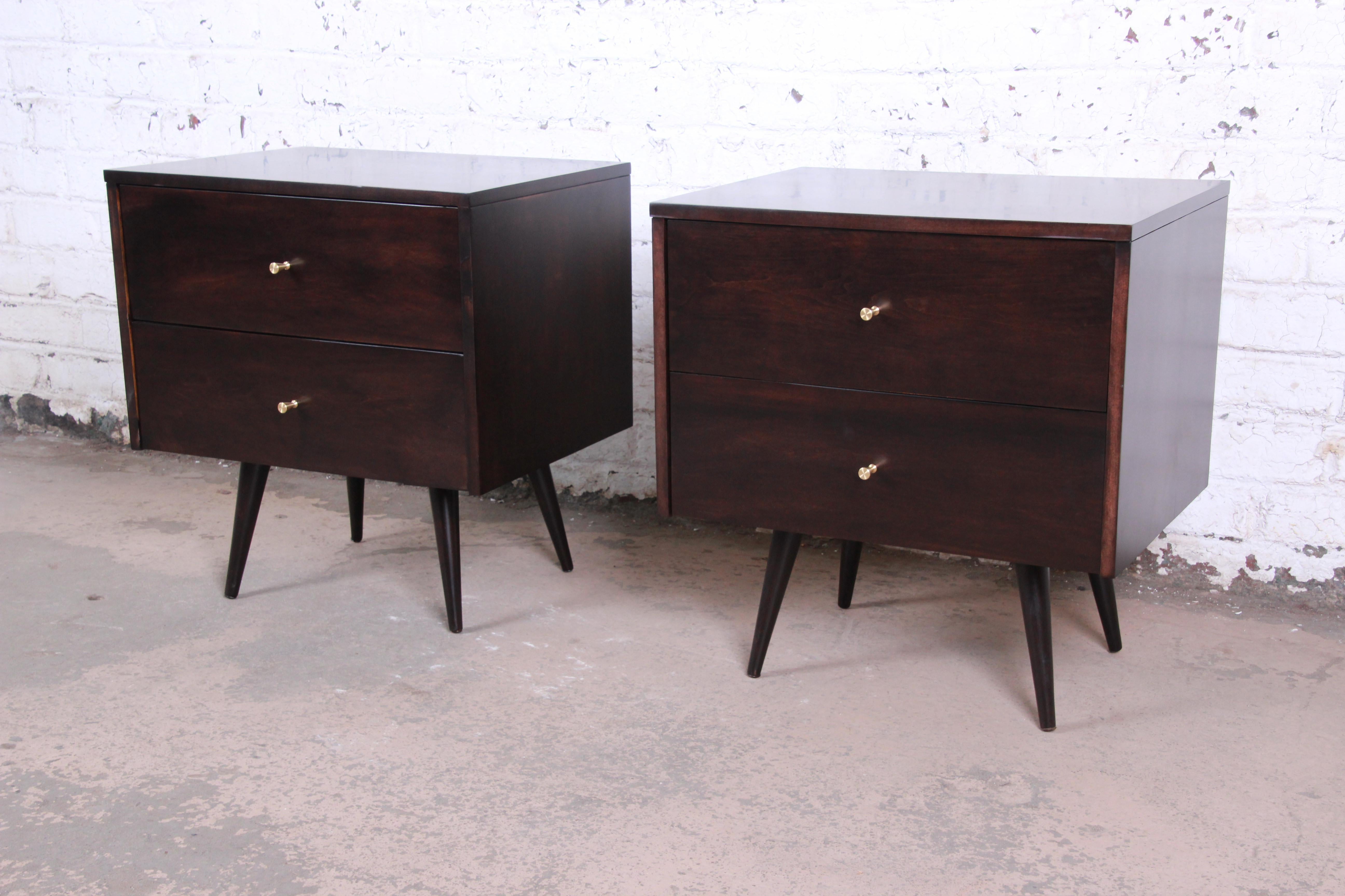 An exceptional pair of Mid-Century Modern nightstands designed by Paul McCobb for his Planner Group line for Winchendon Furniture. The nightstands feature solid birch construction, with gorgeous wood grain and sleek, Minimalist mid-century design.
