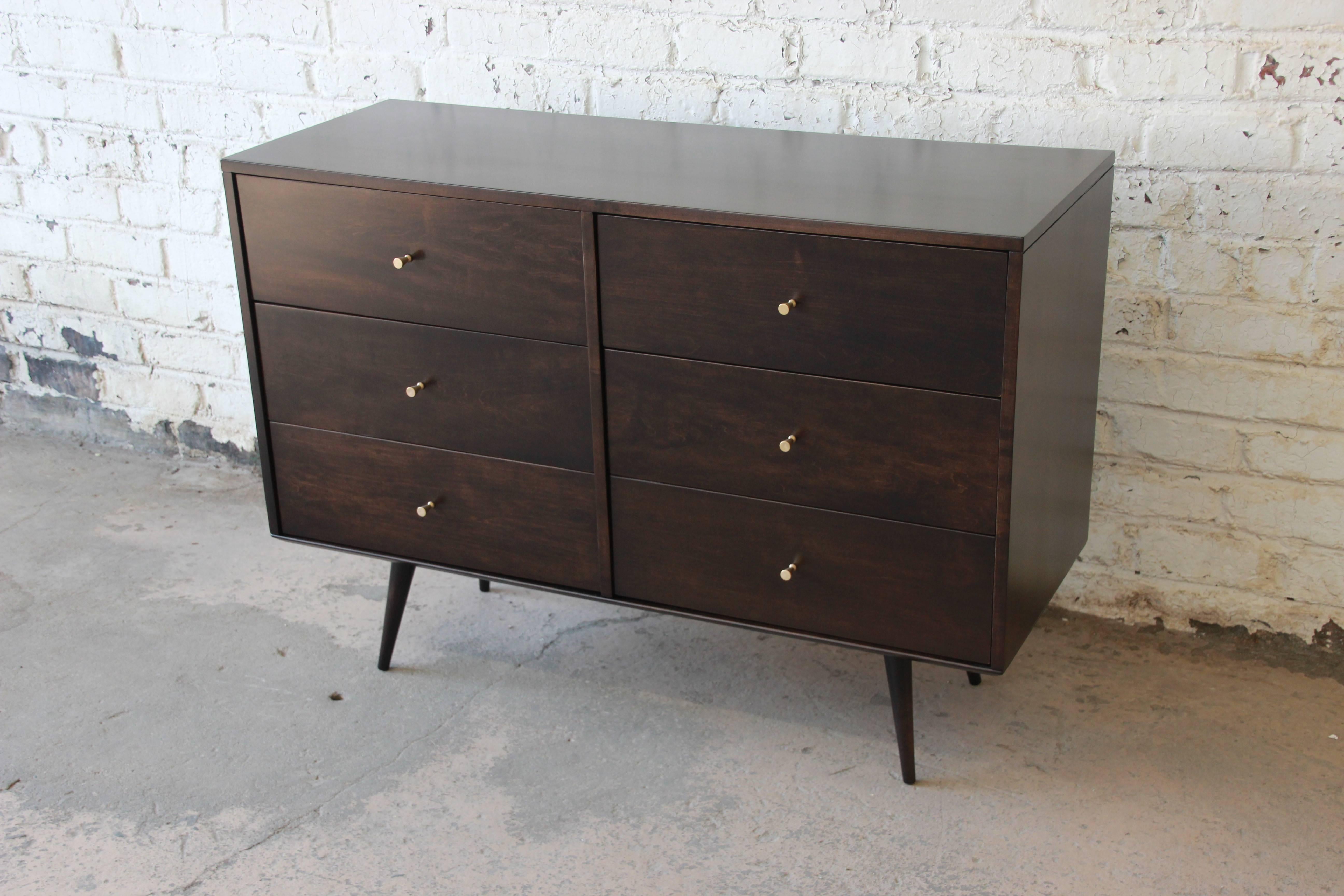 An exceptional Mid-Century Modern six-drawer dresser designed by Paul McCobb for the Planner Group line by Winchendon Furniture. The dresser features solid birch construction and sleek and stylish midcentury lines, the case resting on tall tapered