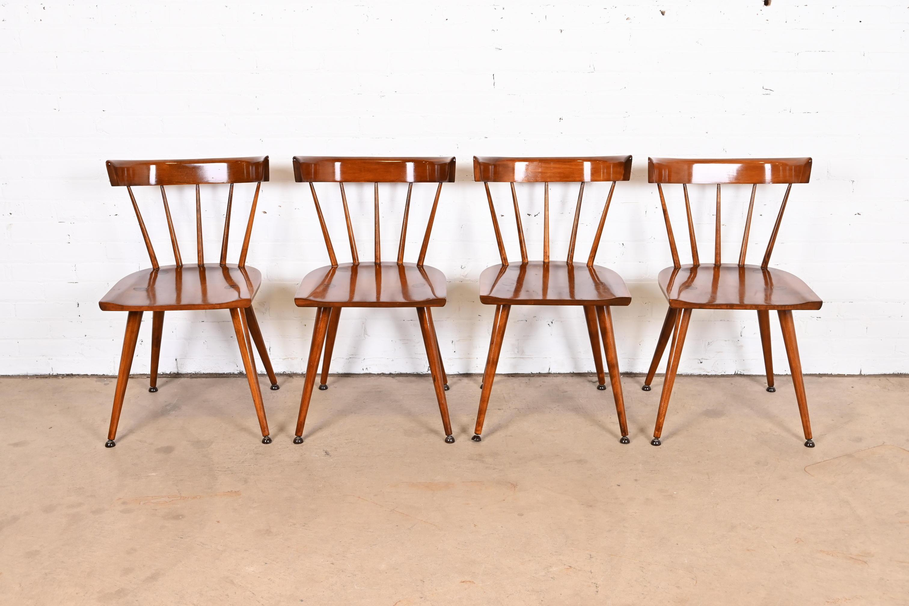An exceptional set of four iconic mid-century modern solid birch spindle back dining chairs

By Paul McCobb for Winchendon Furniture, 