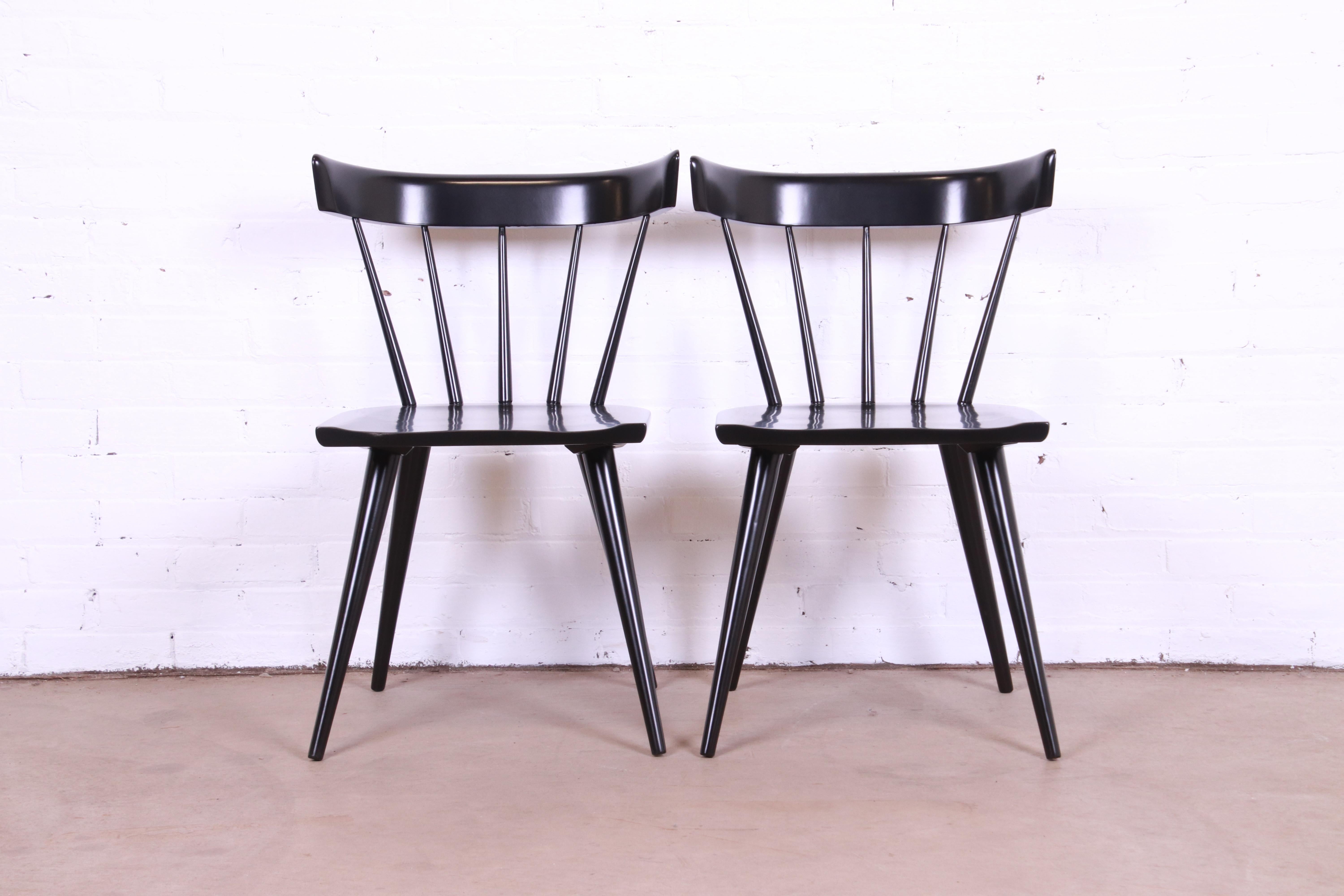 An exceptional pair of iconic mid-century modern spindle back dining chairs

By Paul McCobb for Winchendon Furniture, 