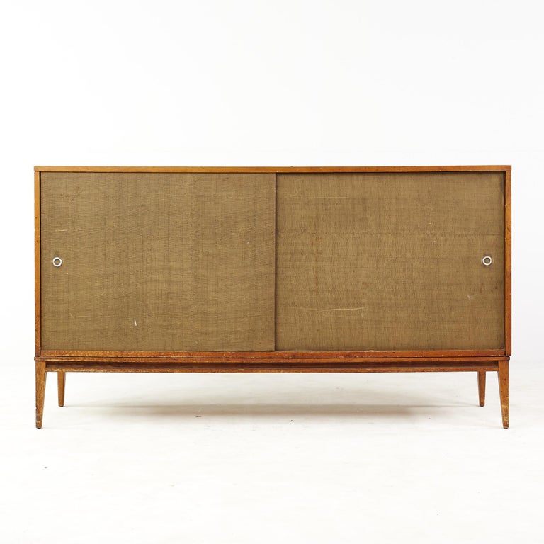 Paul McCobb planner group mid century sliding door credenza

This credenza measures: 60 wide x 18 deep x 33.5 inches high

All pieces of furniture can be had in what we call restored vintage condition. That means the piece is restored upon
