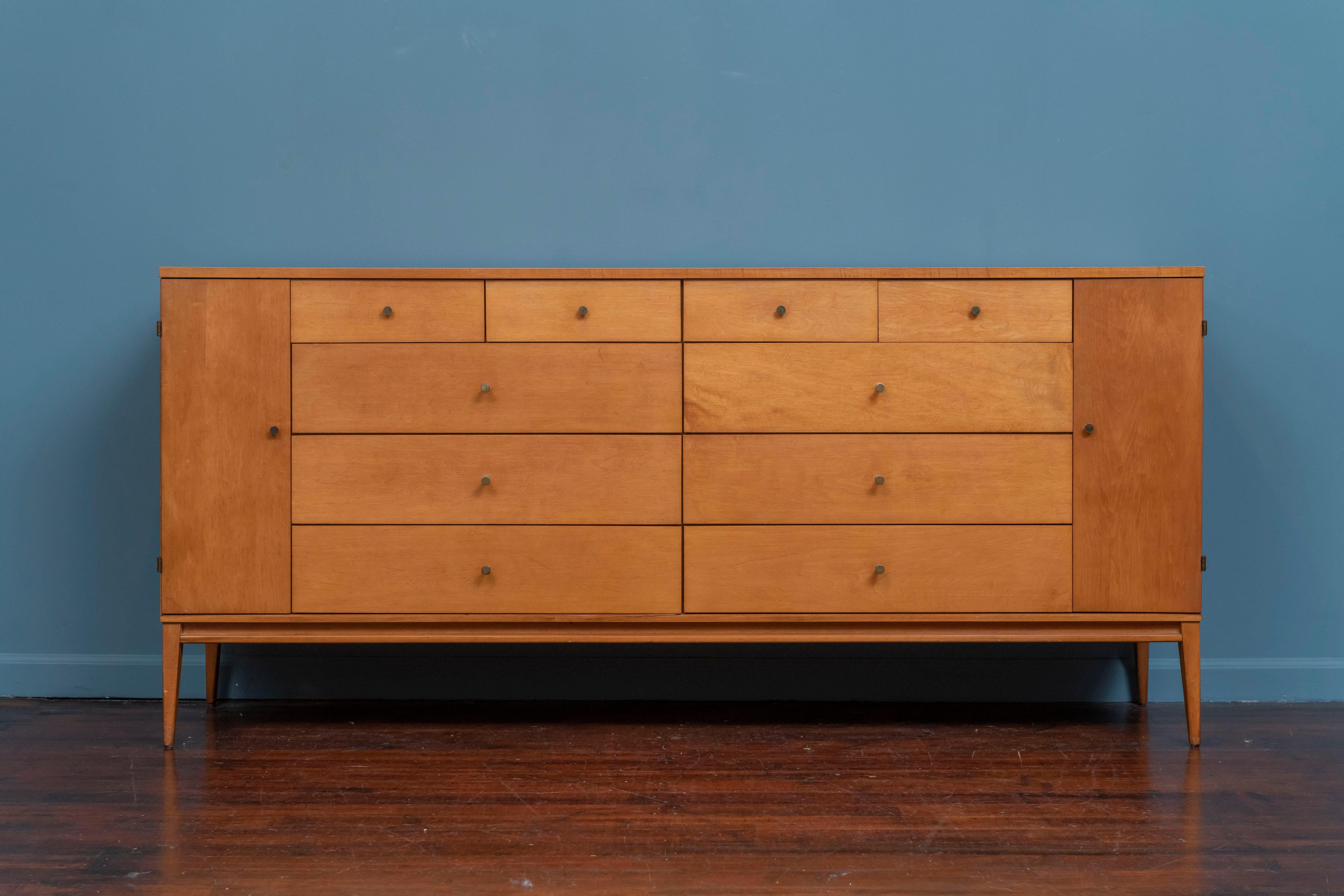 Paul McCobb Planner Group, Model 1510 dresser for Winchendon Furniture. The embodiment of Mid-Century Modern aesthetic combined with a practical design encompassing 20 drawers. 
High quality construction and materials combining solid maple with