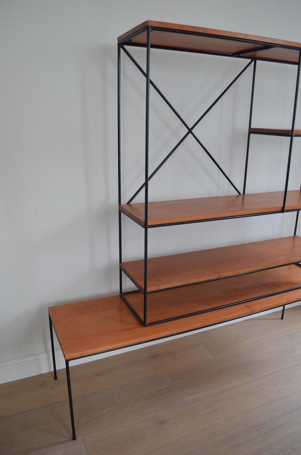 Rare Paul McCobb (1917-1969) planner group room divider shelving unit with bench, designed in circa 1956 for Winchendon Furniture Company, USA.

This two part modular system can be displayed together or separated to form a bench coffee table and