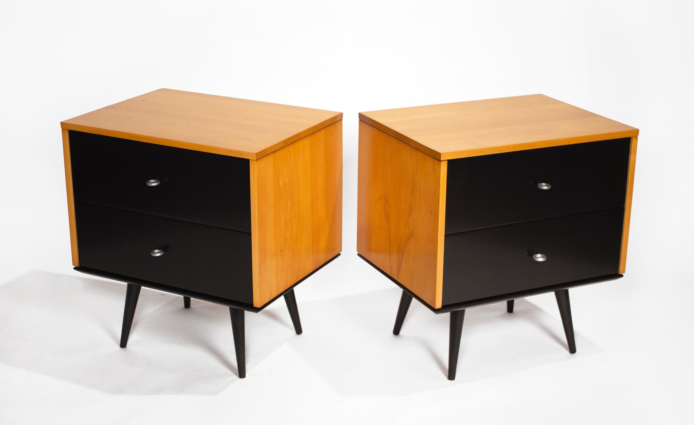 Stunning pair of solid maple Paul McCobb nightstands with original hardware. These cabinets are rock solid and were freshly refinished in a period-appropriate amber lacquer. Ultra-modern and indestructible.