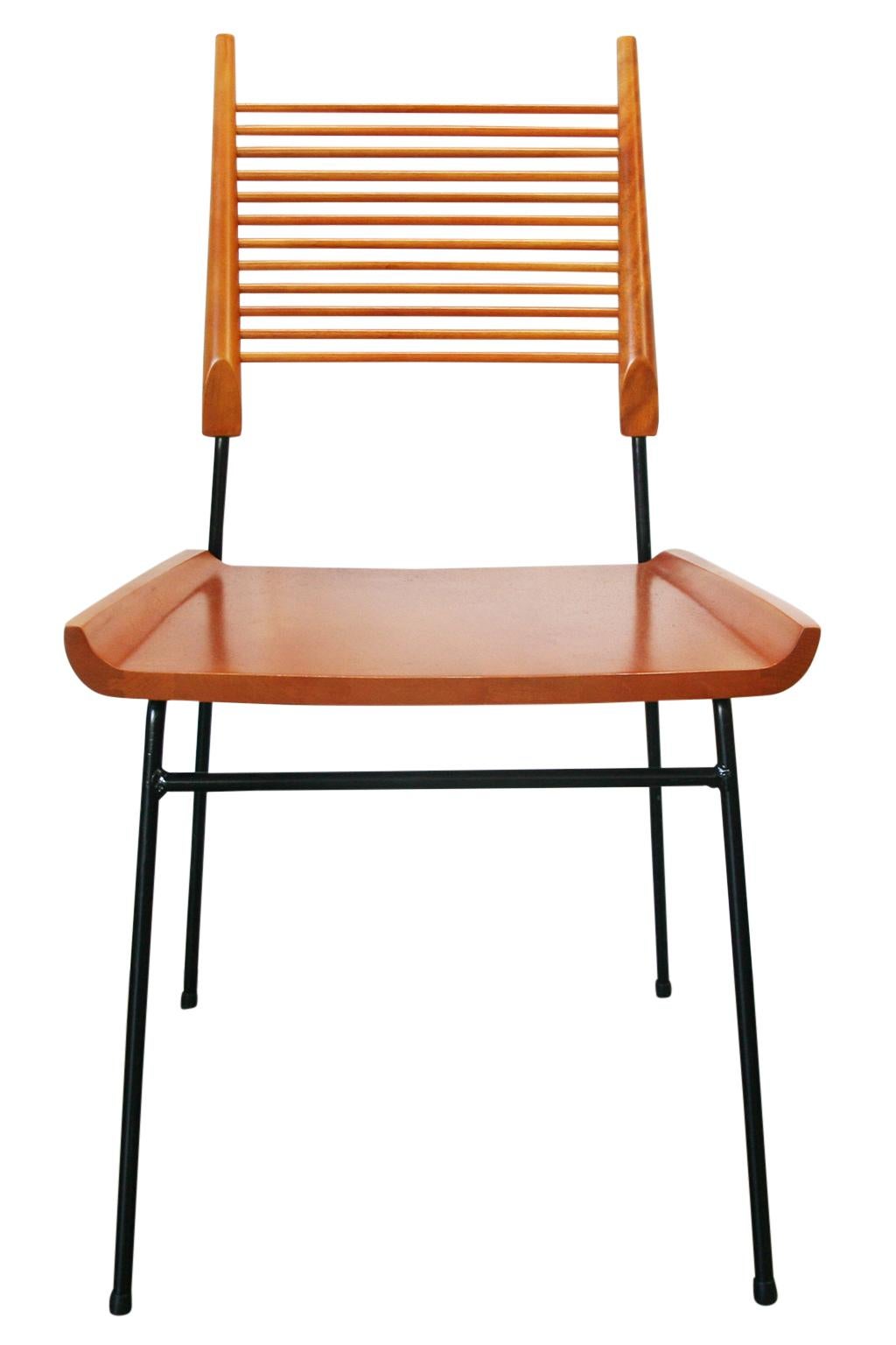 For your consideration are these professionally restored midcentury maple and iron Paul McCobb Planner Group #1533 shovel side dining chairs. Solid maple seat and Minimalist spindle backrest attached to an Iron base. Each chair is fully restored