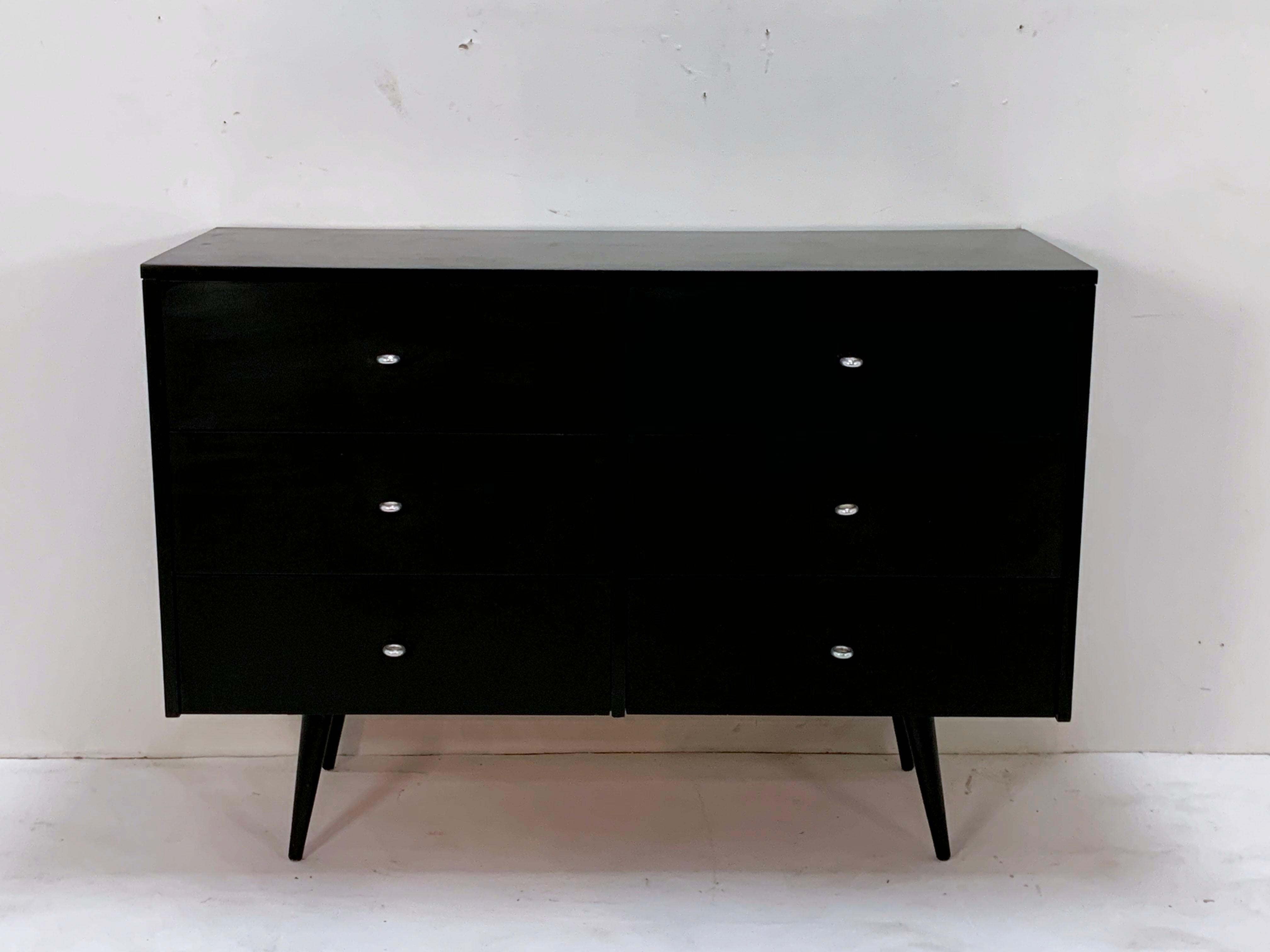 Mid-Century Modern chest of drawers in original black lacquer finish designed by Paul McCobb for Winchendon Furniture Co.'s Planner Group, circa 1950s.
 