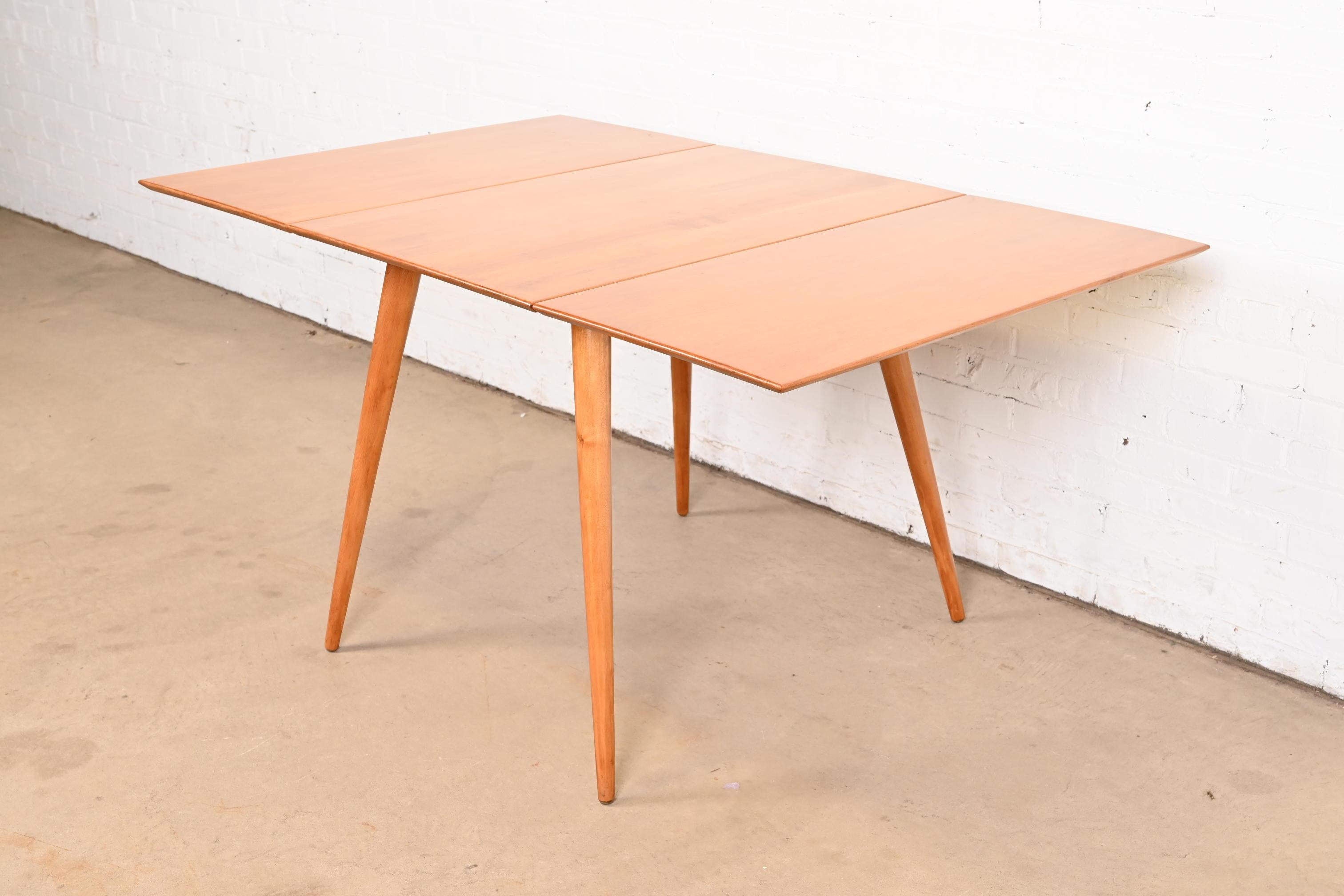 A sleek and stylish Mid-Century Modern solid maple drop-leaf dining table

By Paul McCobb for Winchendon Furniture, 