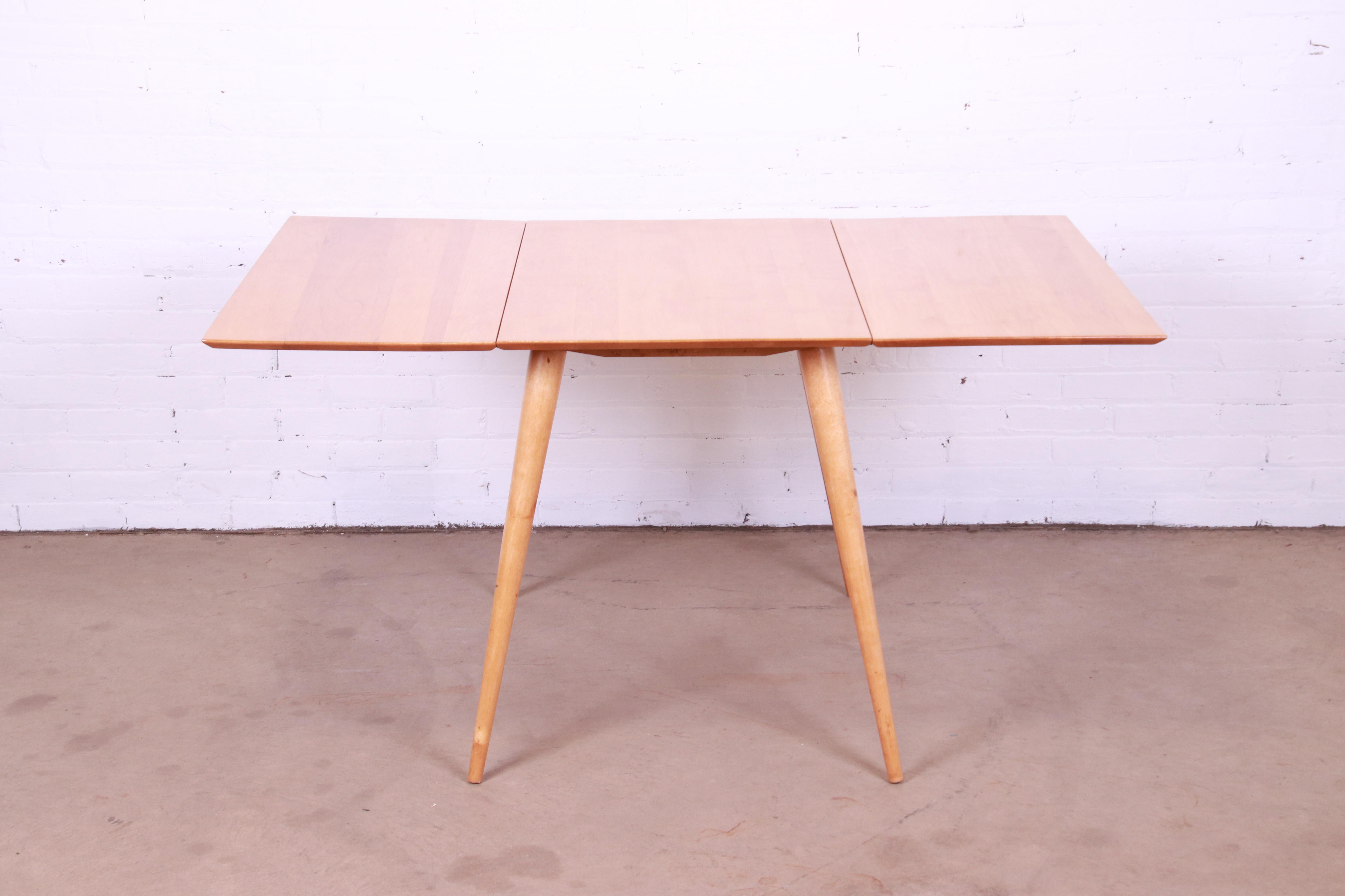 A sleek and stylish Mid-Century Modern solid maple drop-leaf dining table

By Paul McCobb for Winchendon Furniture, 