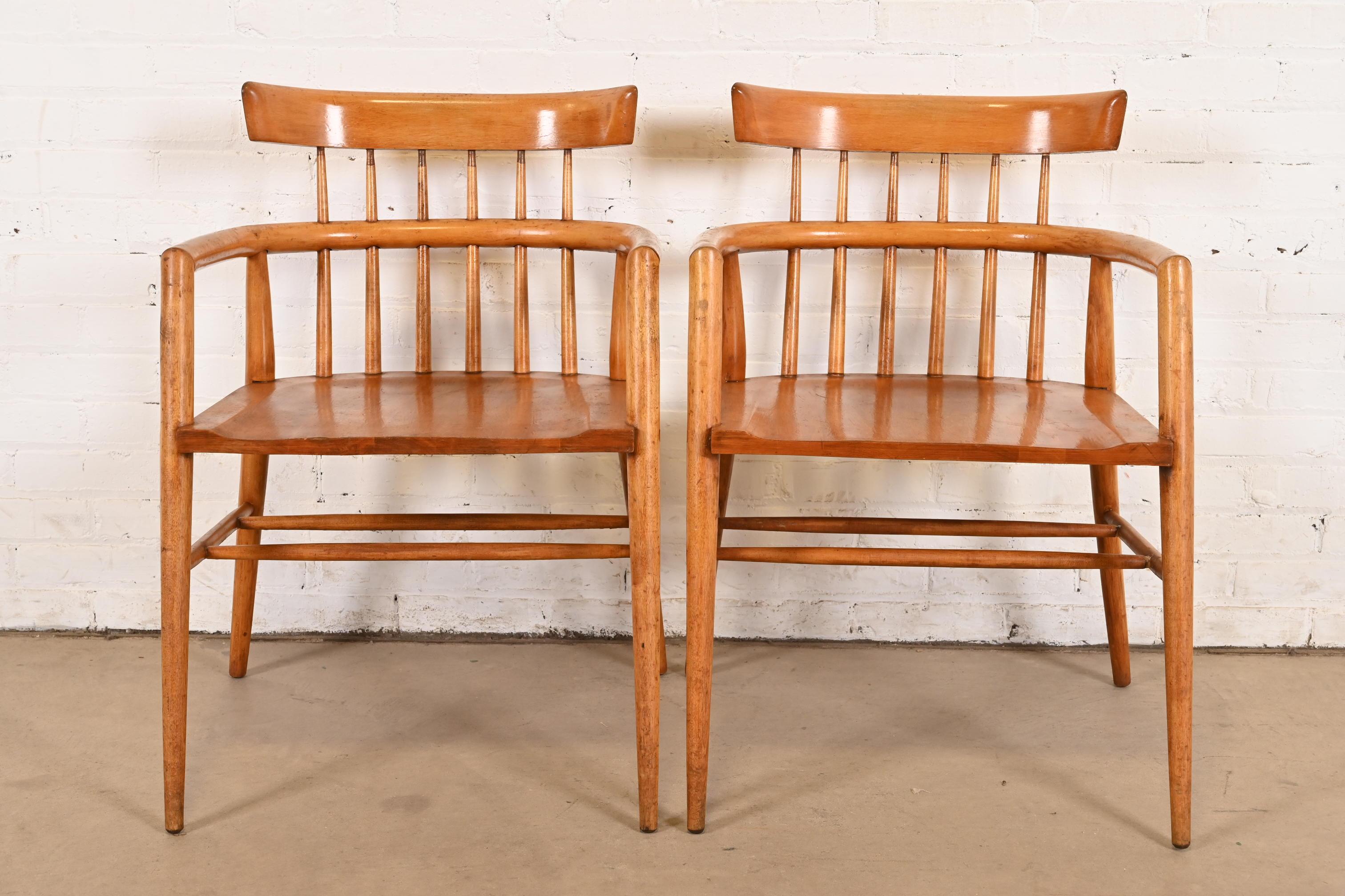 An exceptional pair of iconic Mid-Century Modern spindle back dining captain chairs or armchairs

By Paul McCobb for Winchendon Furniture, 