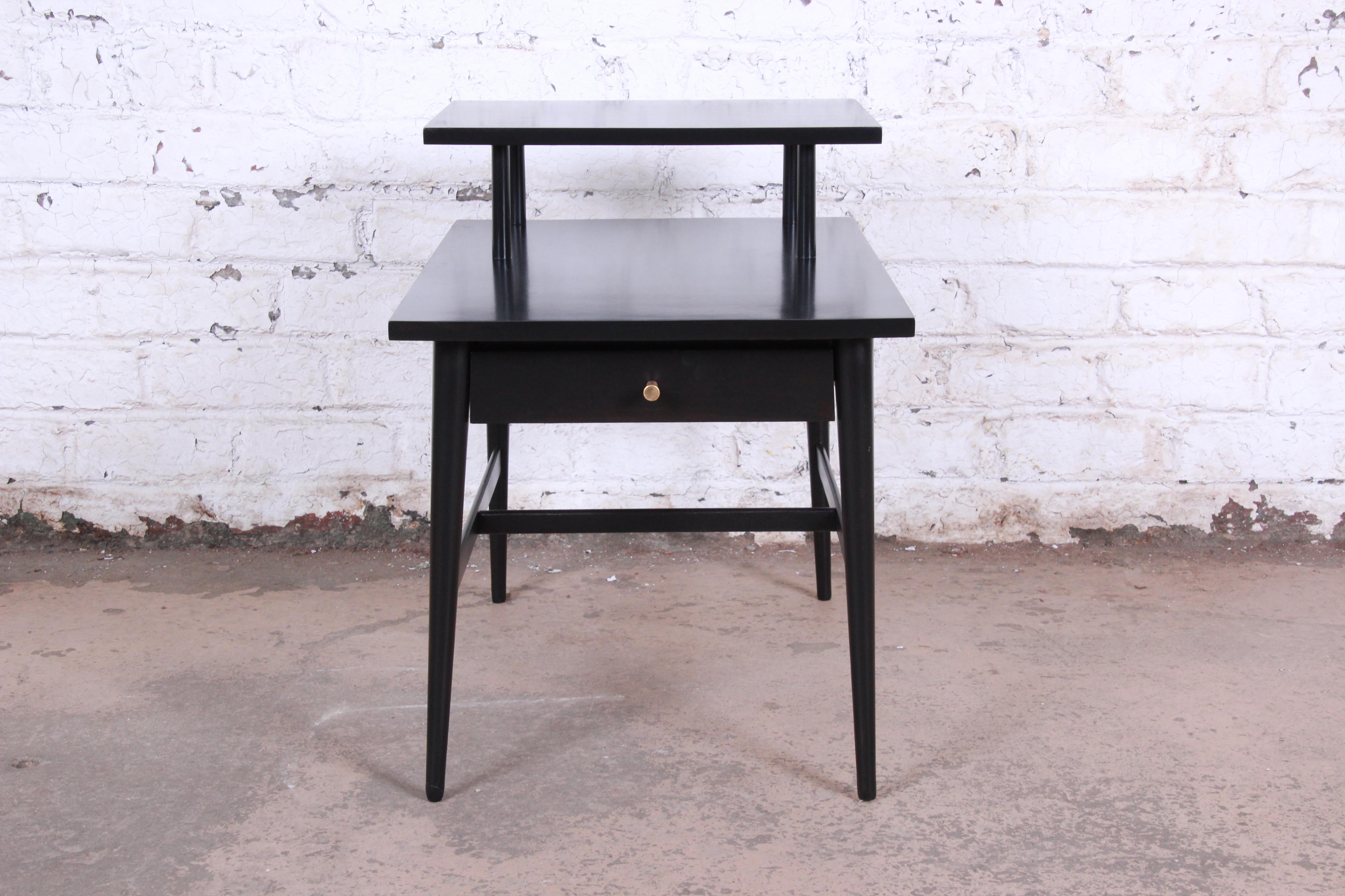 A gorgeous newly refinished nightstand or end table designed by Paul McCobb for his Planner Group line for Winchendon Furniture. One of the more rare pieces from this line, the end table is an excellent example of McCobb's minimalist design work. It