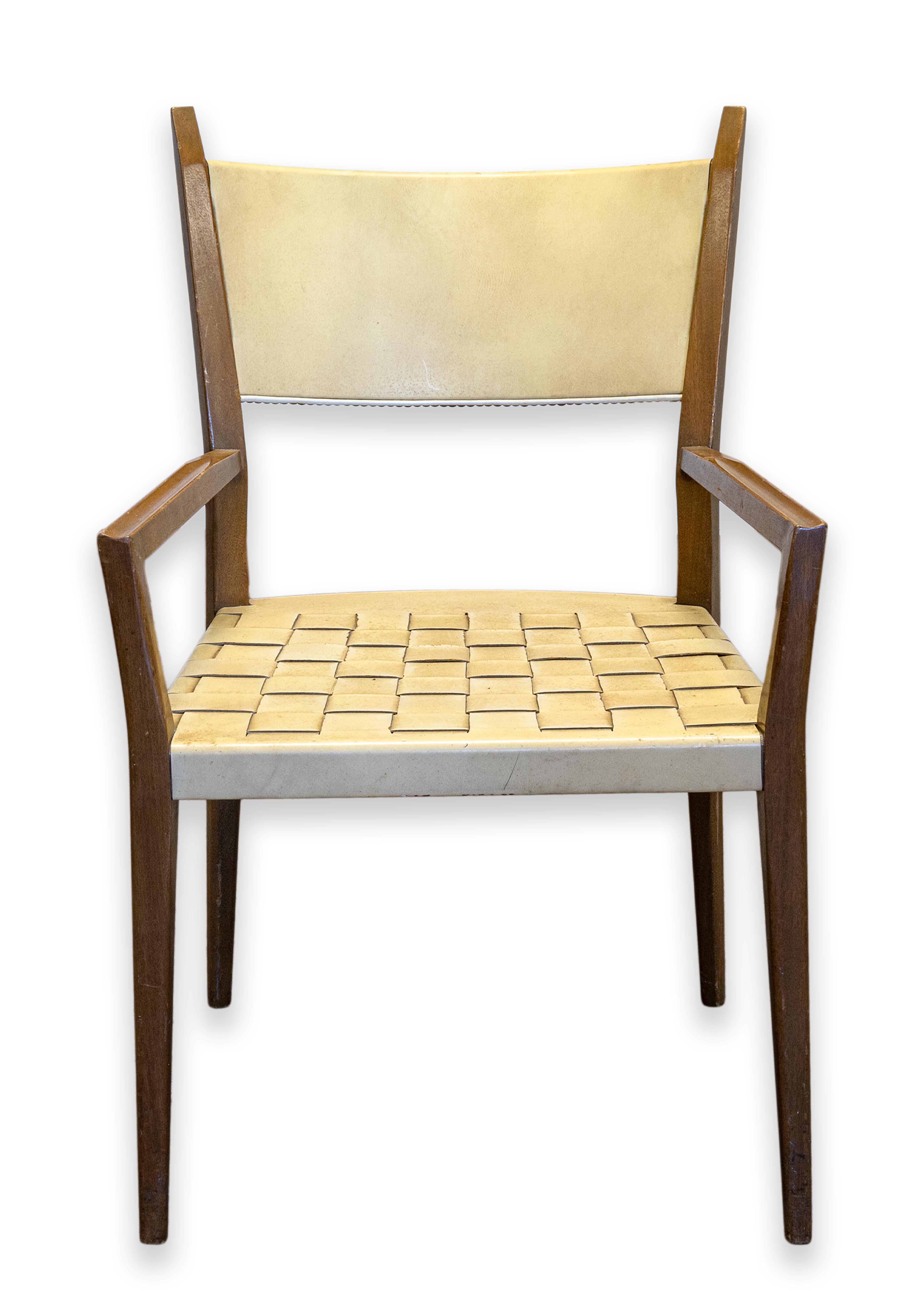 An early modern armchair prototype designed by Paul McCobb for Calvin Furniture Co. Circa 1962. Danish Scandinavian style with beige woven leather strapping on a mahogany wood frame with tapered legs. Calvin Furniture Co. of Grand Rapids, MI was