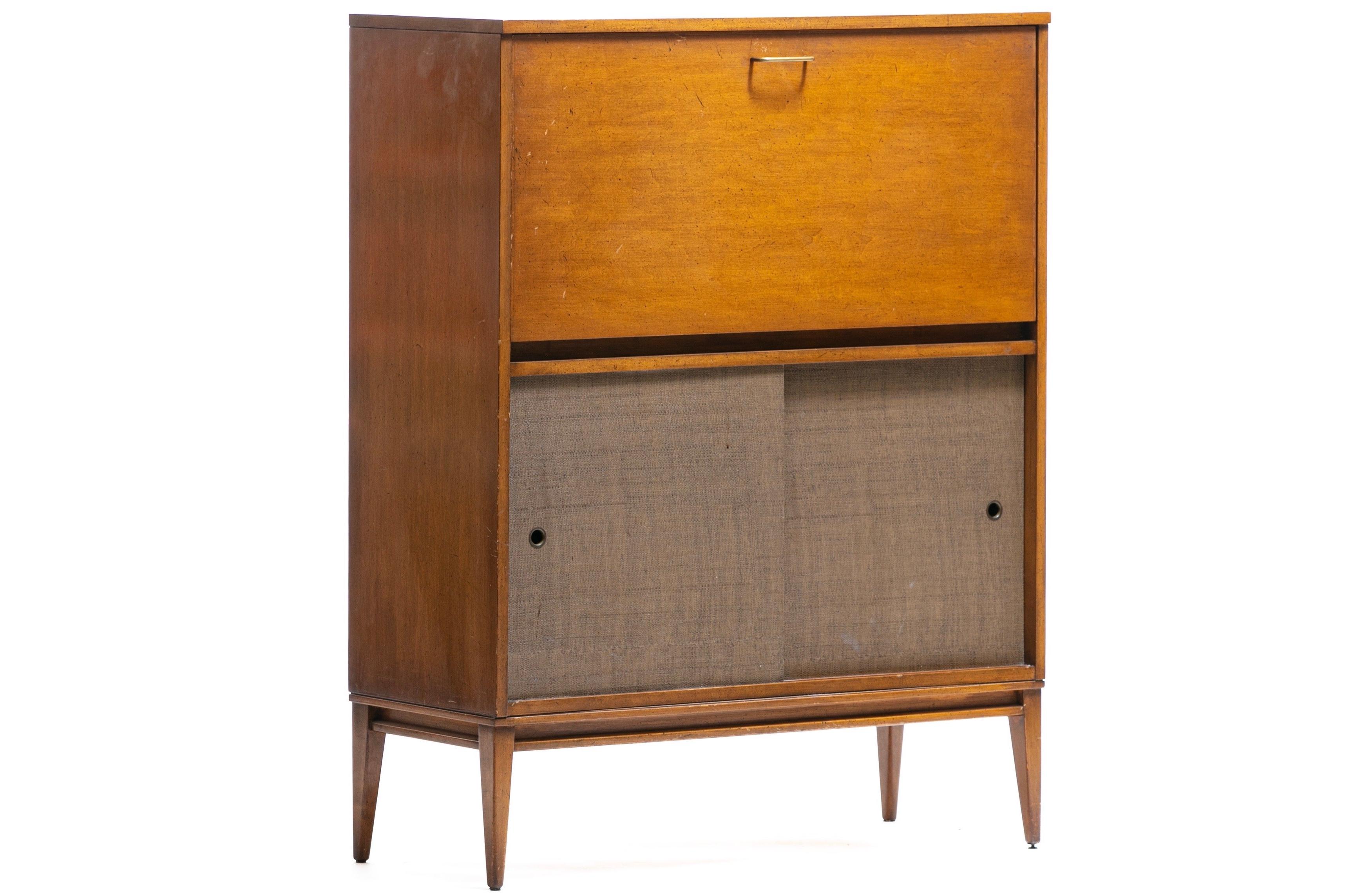 Famed Mid-Century Modern Designer Paul McCobb is celebrated for his unique ability to combine sleek design with common sense functionality and this 1950s Paul McCobb secretary desk designed for Winchendon Furniture Company exemplifies just that - a