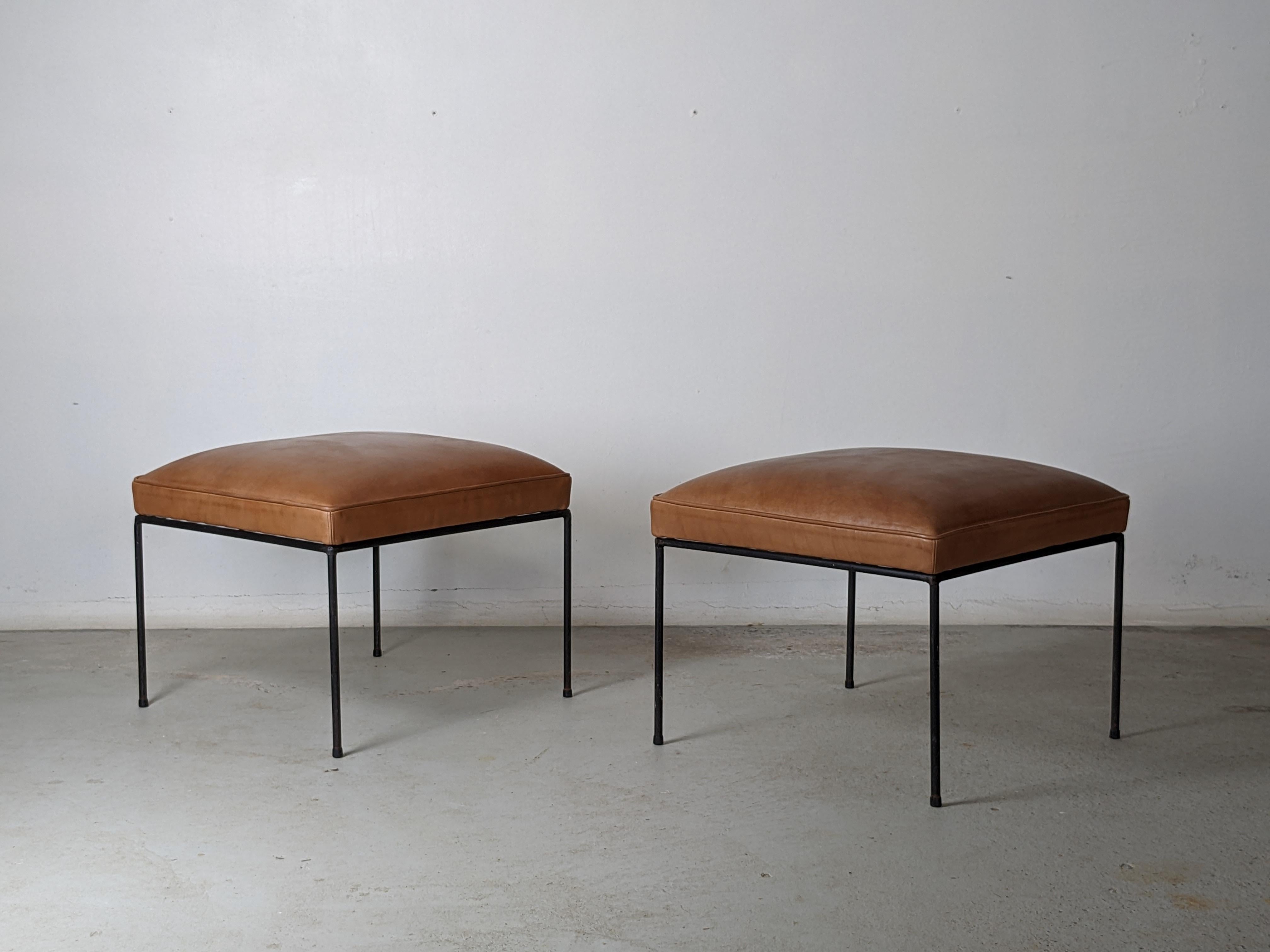 Set of 2 Mid-Century Modern iron stools by Paul McCobb.

Newly reupholstered as they originally were, with no-sag springs, foam and a thick vintage looking brown leather.

Original condition for the iron feet with light surface rust on some