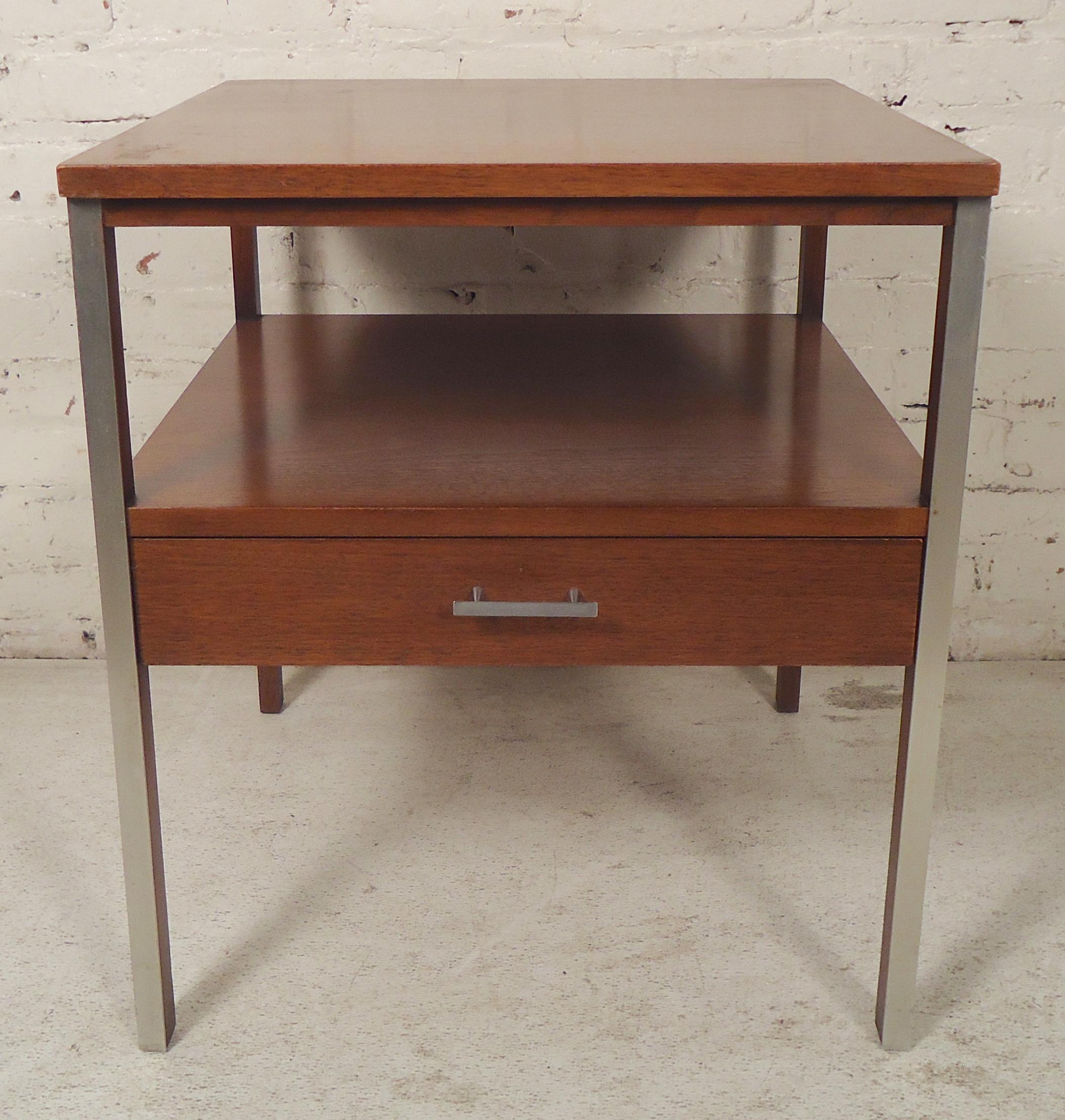Mid-Century Modern end table designed by Paul McCobb for his Calvin line. Walnut grain with accenting chrome handle and trim.
(Please confirm item location - NY or NJ - with dealer).
  