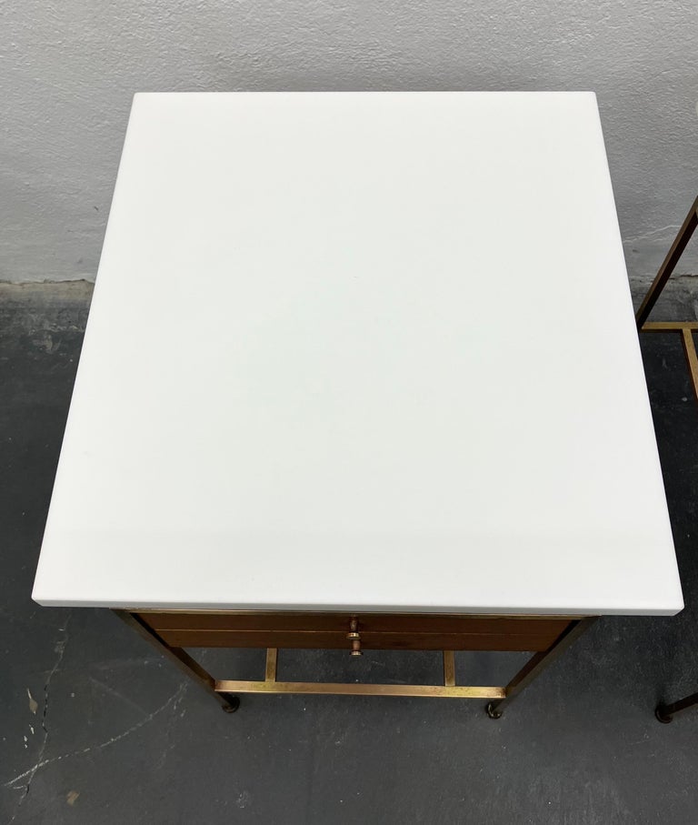 Rare pair of Paul Mccobb side tables retaining the original white 