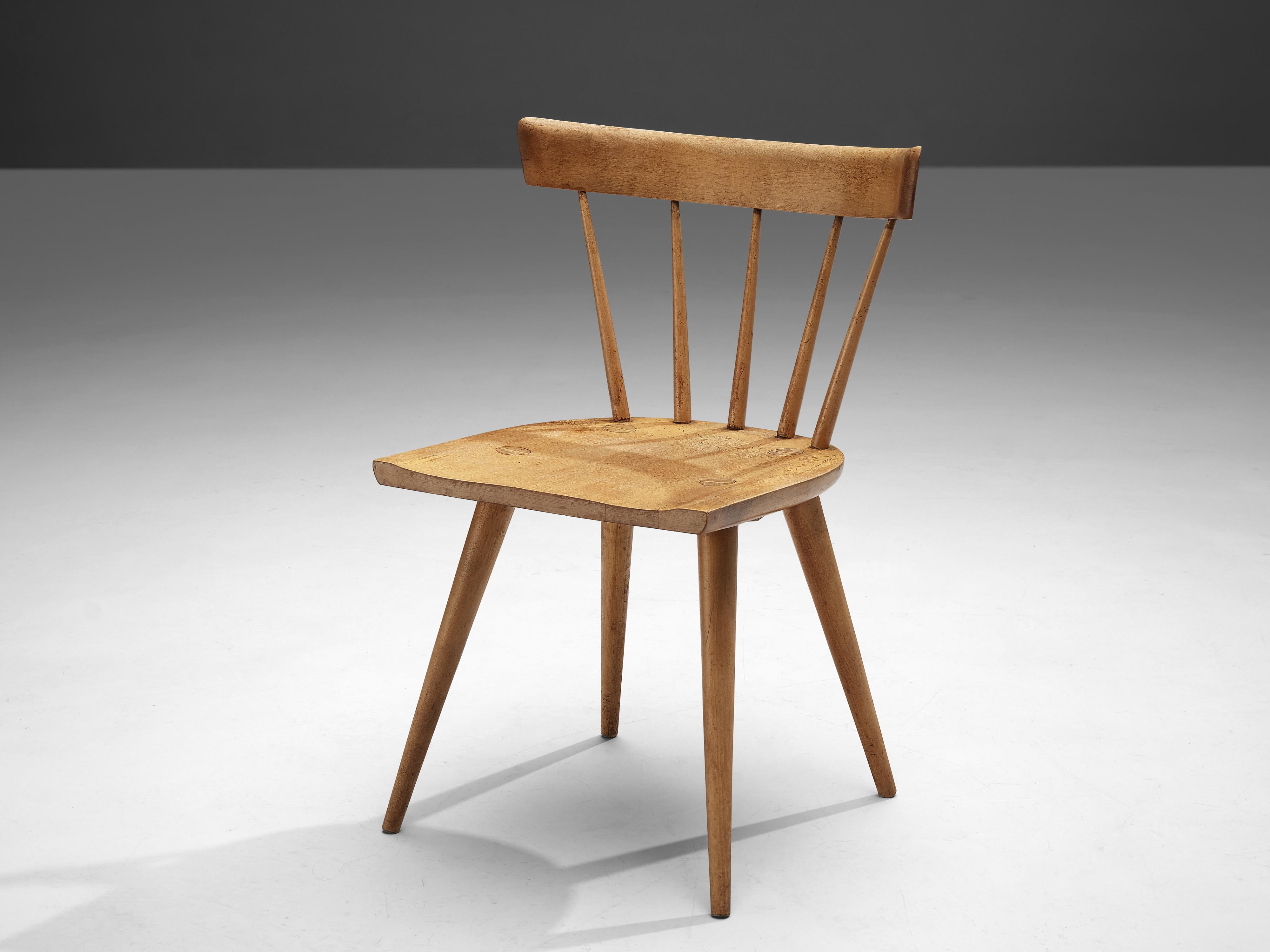 Paul McCobb, side chair, birch, United States, 1950s

Beautifully patinated Paul McCobb side chair. This well-composed chair combines aesthetics with comfort. A curved backrest held by thin spindles supports the sitter's back. A comfortably carved