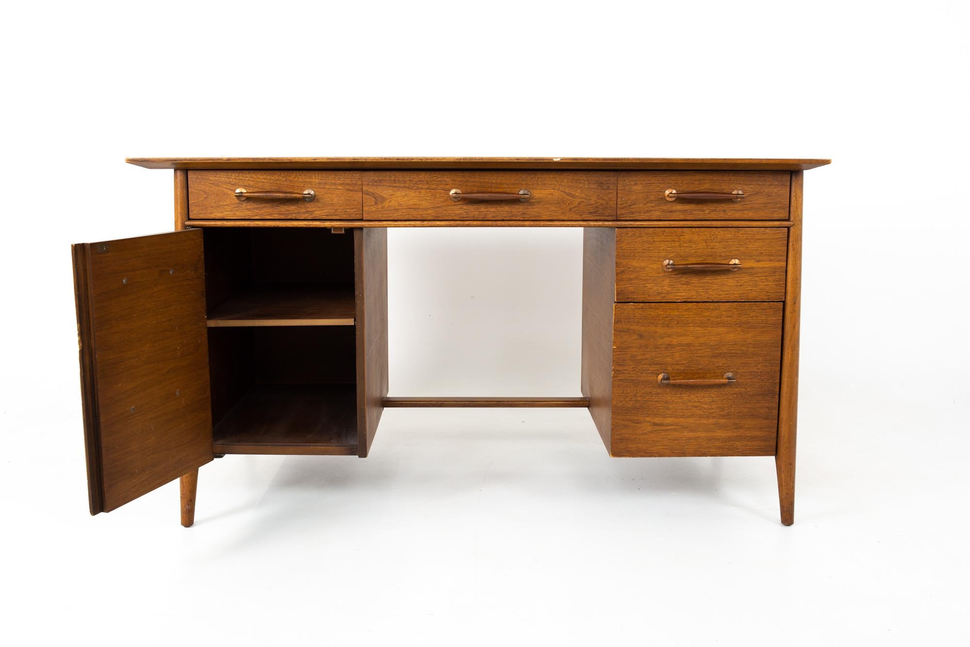 Paul McCobb style Henredon heritage Mid Century walnut 1-door 5-drawer desk
Desk measures: 54 wide x 28 deep x 30.5 high

All pieces of furniture can be had in what we call restored vintage condition. This means the piece is restored upon purchase
