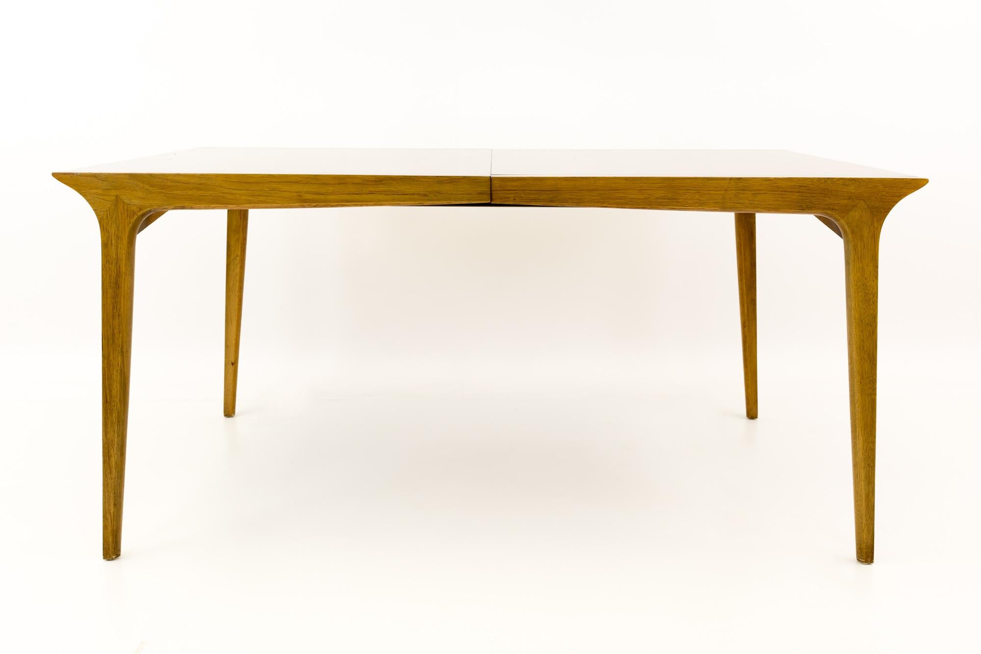Paul McCobb Style John Van Koert for Drexel Profile Mid Century 10 Person dining table

This table measures 54 wide x 36 deep x 29 inches high, with a chair clearance of 27 inches; each leaf is 12 inches wide, making a maximum table width of 90