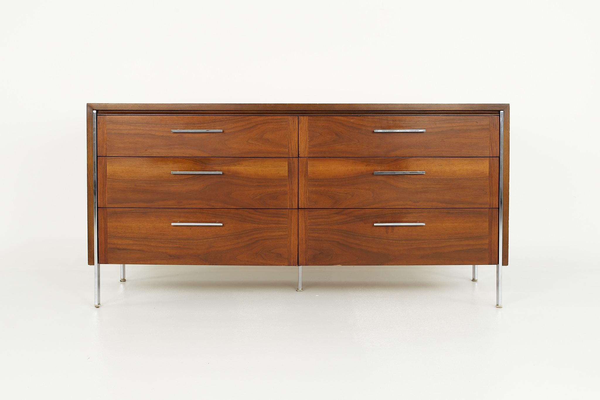Paul McCobb style lane mid century 6-drawer walnut and chrome lowboy dresser

This dresser measures: 62 wide x 18 deep x 30 inches high

?All pieces of furniture can be had in what we call restored vintage condition. That means the piece is