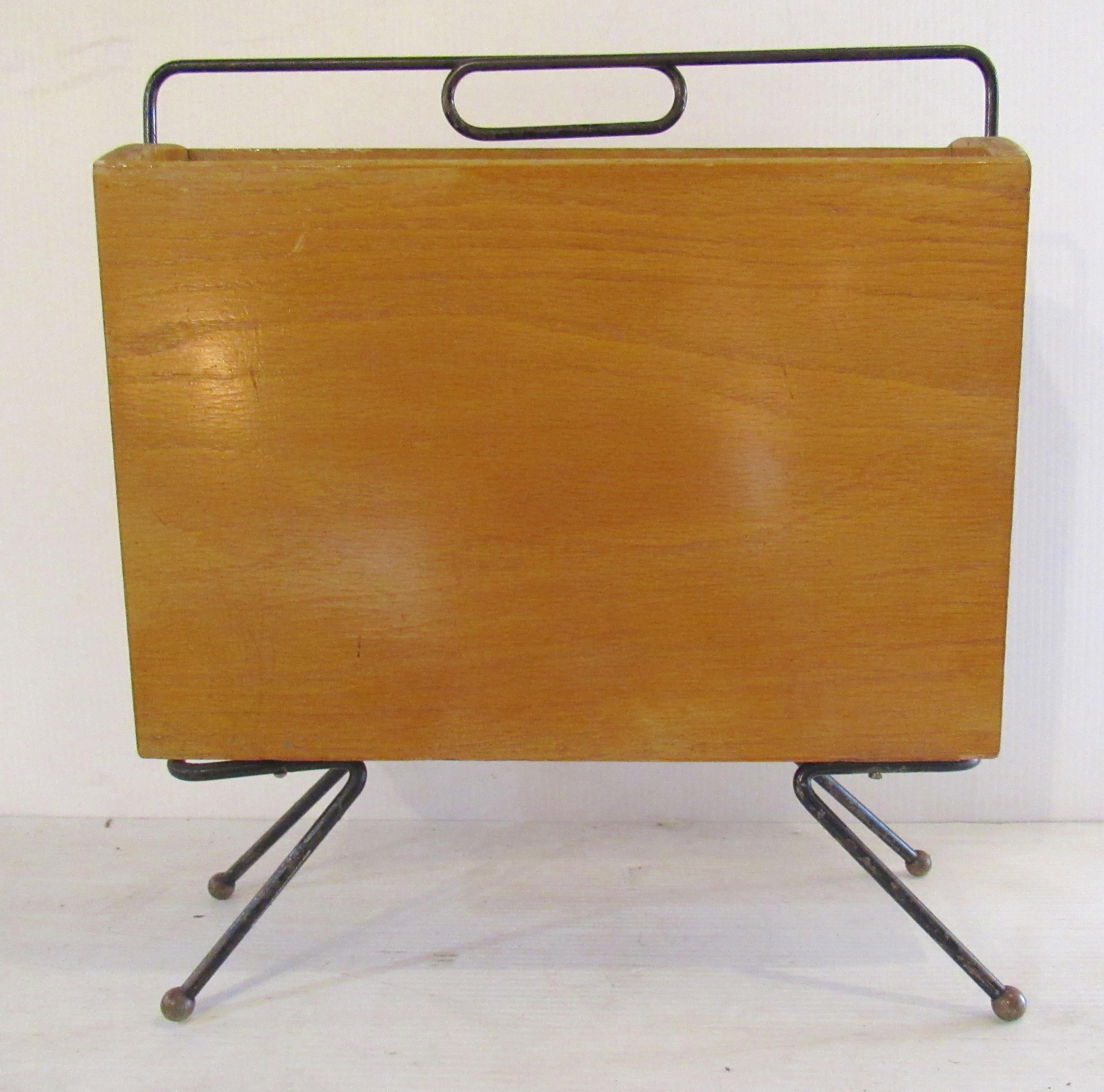 Mid-Century Modern magazine rack made of maple and black painted iron frame.
(Please confirm item location - NY or NJ - with dealer).
  