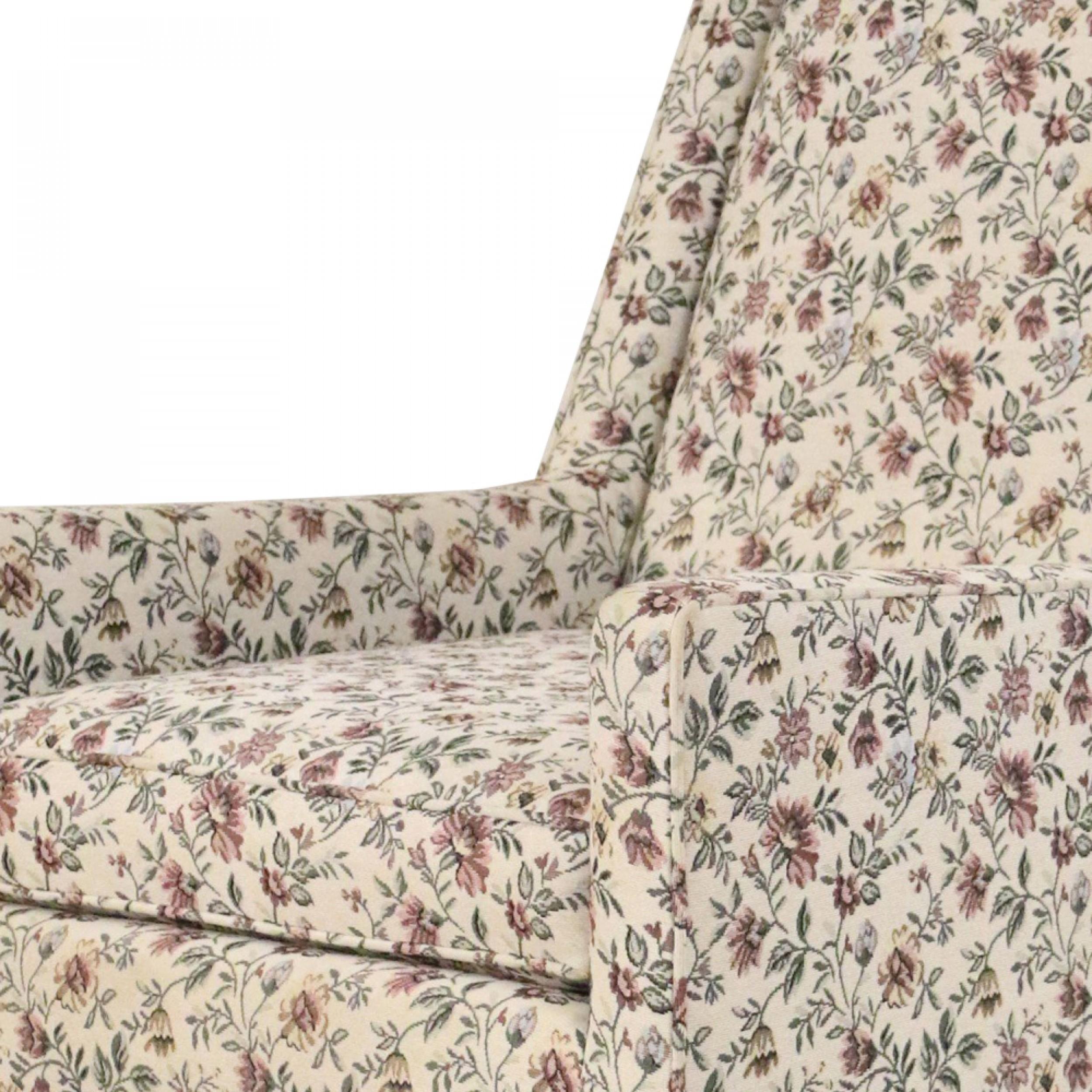 Mid-Century Modern upholstered lounge / armchair with beige, green, and pink floral upholstery and tapered wooden peg legs (attributed to PAUL MCCOBB)
