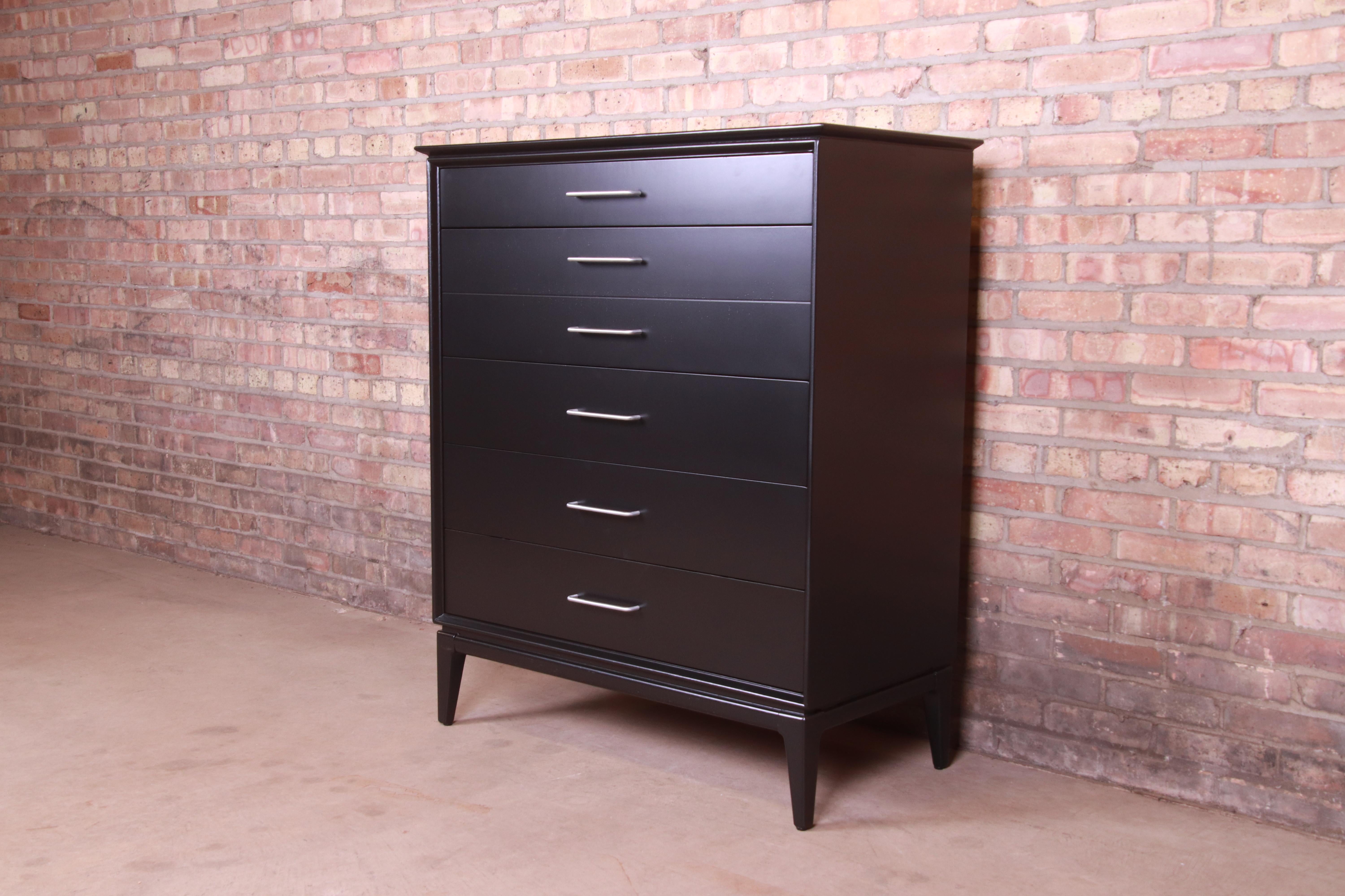 A gorgeous Mid-Century Modern highboy dresser chest

In the manner of Paul McCobb

By Century Furniture

USA, 1960s

Black lacquered walnut, with metal hardware.

Measures: 38
