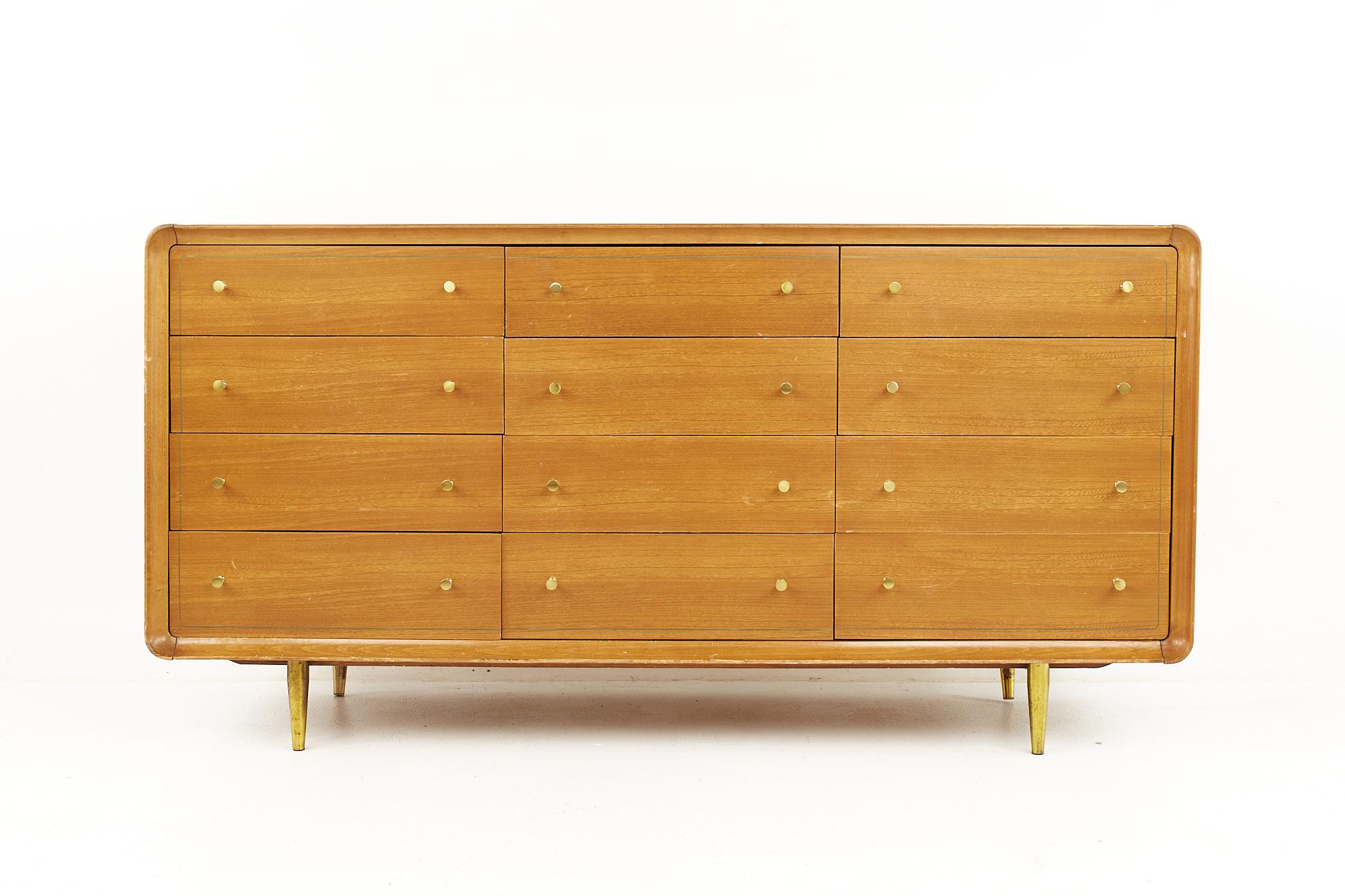 Cavalier mid century walnut and brass 12 drawer lowboy dresser.

The dresser measures: 64 wide x 20 deep x 33.25 inches high.

All pieces of furniture can be had in what we call restored vintage condition. That means the piece is restored upon