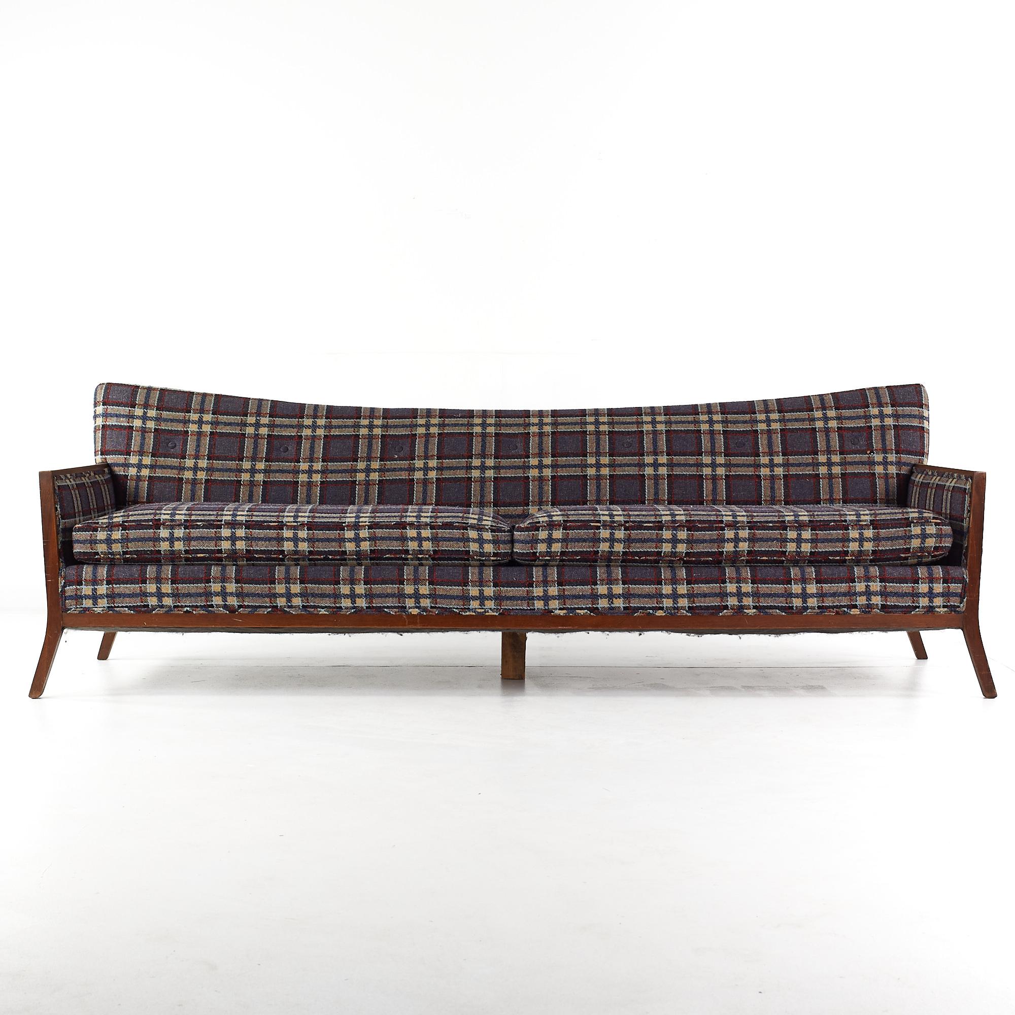 Paul McCobb style mid-century walnut sofa.

This sofa measures: 97 wide x 31 deep x 32.5 inches high, with a seat height of 19 and arm height of 23.25 inches.

All pieces of furniture can be had in what we call restored vintage condition. That