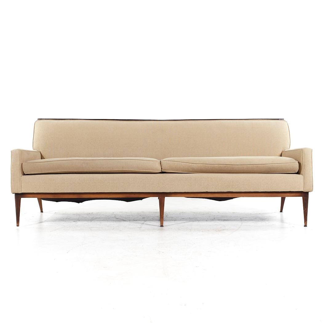 Paul McCobb Style Mid Century Walnut Sofa

This sofa measures: 84 wide x 33 deep x 31 inches high, with a seat height of 19 and arm height of 22 inches

All pieces of furniture can be had in what we call restored vintage condition. That means the