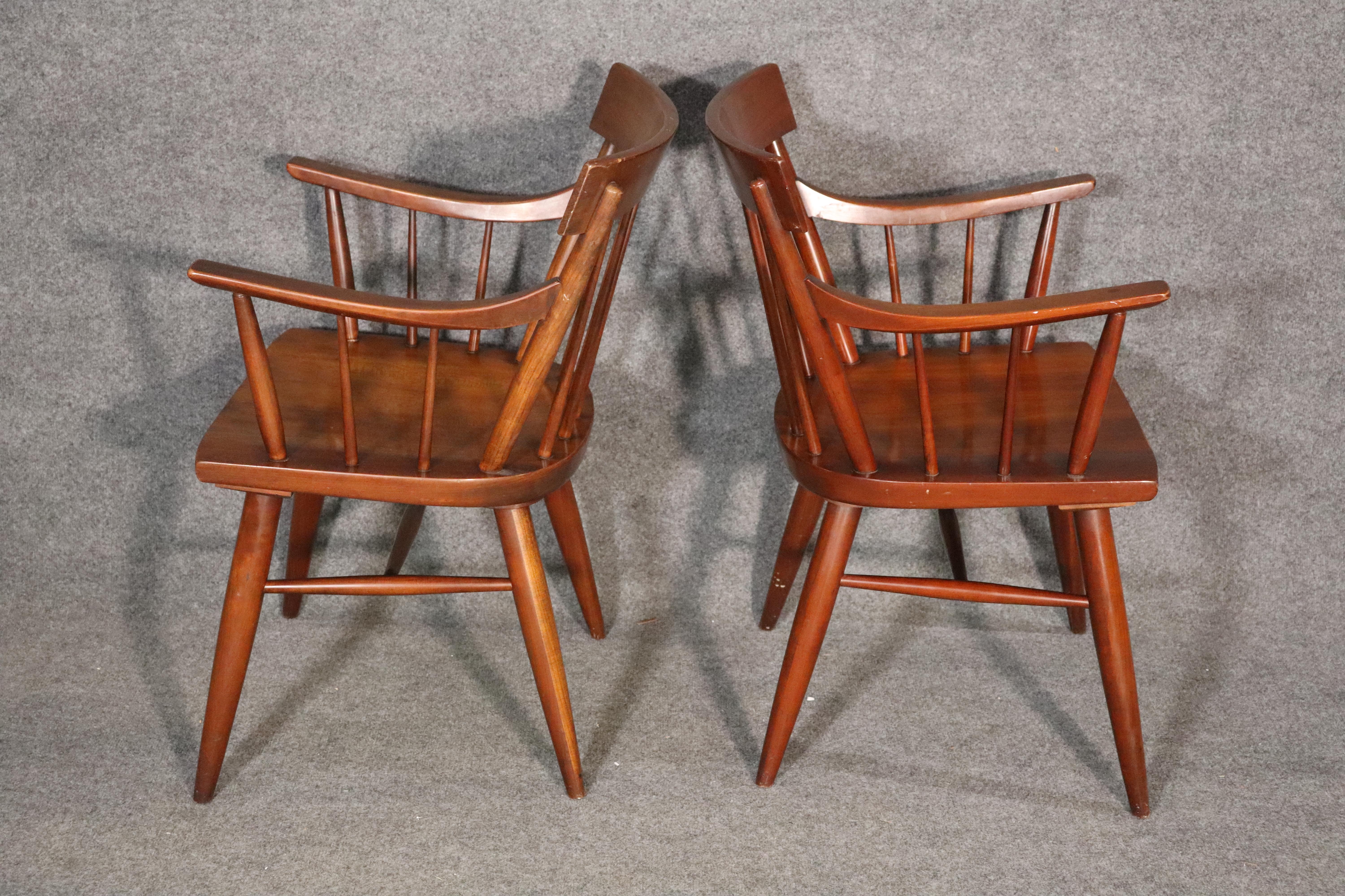 Set of six dining chairs, four armless, 2 throne chairs, with spindle backs. Closely resembling the iconic Planner Group chairs by Paul McCobb, with tapered spindles and shovel seats. The armchairs have a nice swoop design.
Please confirm location