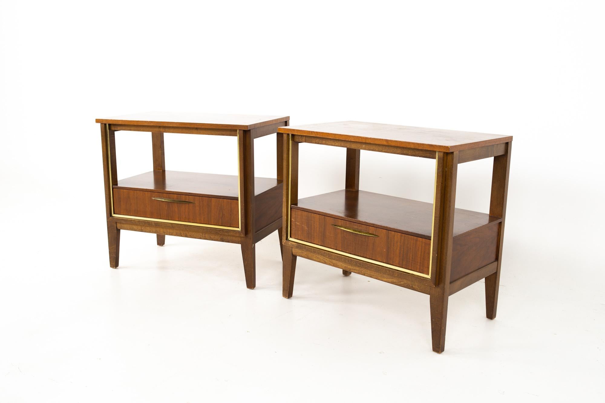 Paul McCobb style West Michigan Furniture Company mid century walnut and brass nightstands - pair.
Each nightstand measures: 24 wide x 15 deep x 23 inches high

All pieces of furniture can be had in what we call restored vintage condition. That