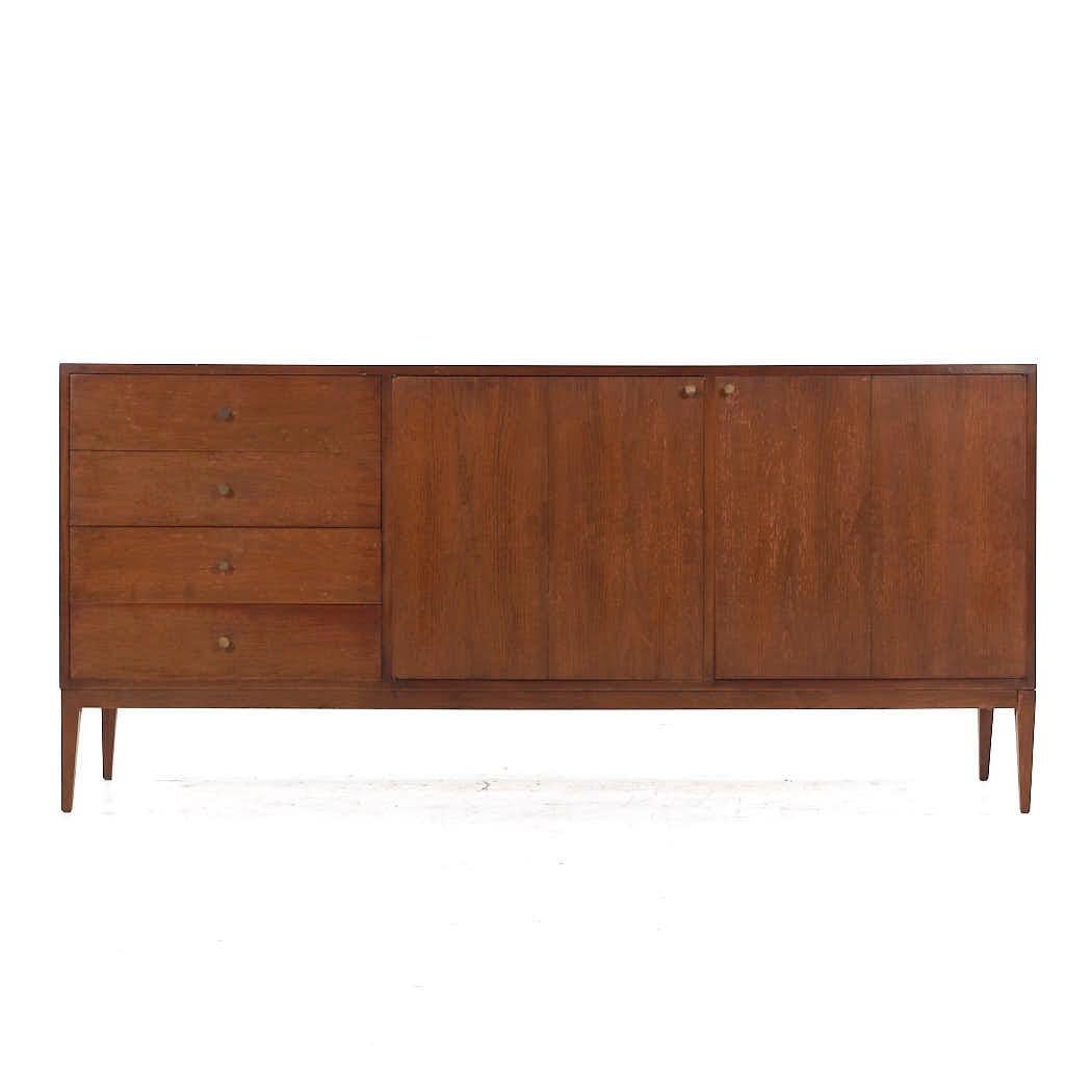 Paul McCobb Style West Michigan Mid Century Walnut and Brass Lowboy Dresser

This lowboy measures: 72 wide x 18 deep x 33.25 inches high

All pieces of furniture can be had in what we call restored vintage condition. That means the piece is restored