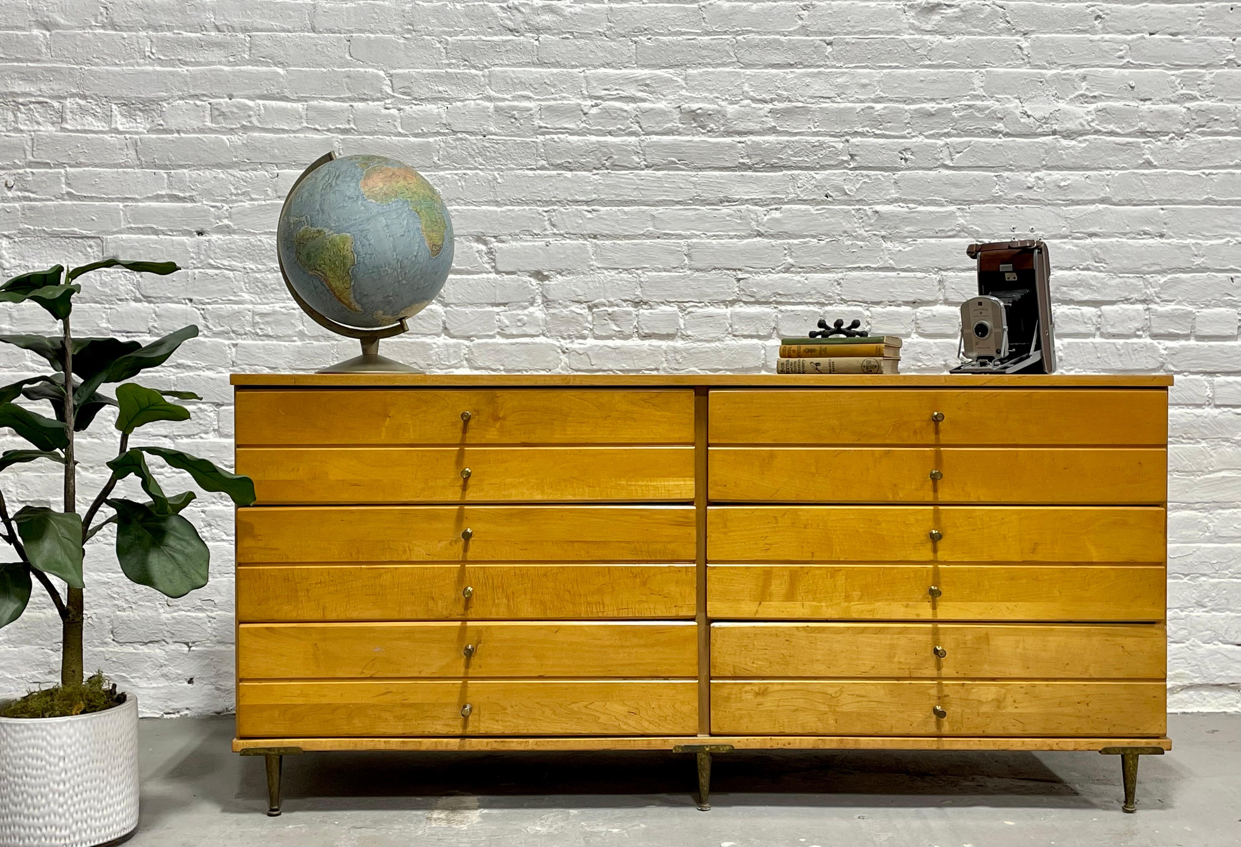 Paul McCobb styled Mid Century Modern Double Dresser / Credenza featuring gorgeous maple wood and uniquely styled metal legs and pulls. This beauty offers loads of storage space for all your clothes in six deep and spacious drawers. The metal pulls