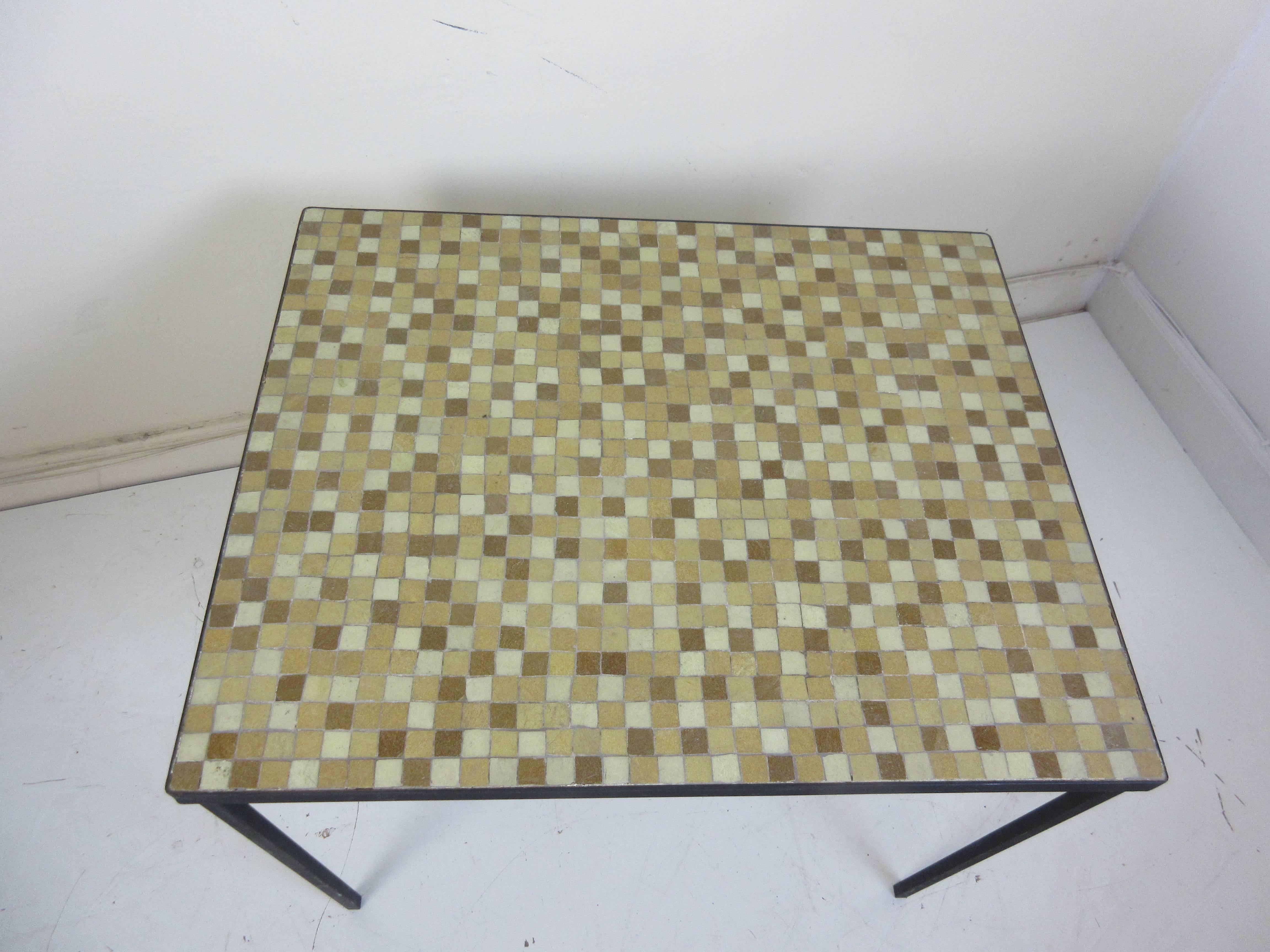 Paul McCobb tile top wrought iron side or lamp table with glass tiles in shades of tan, off-white and brown.