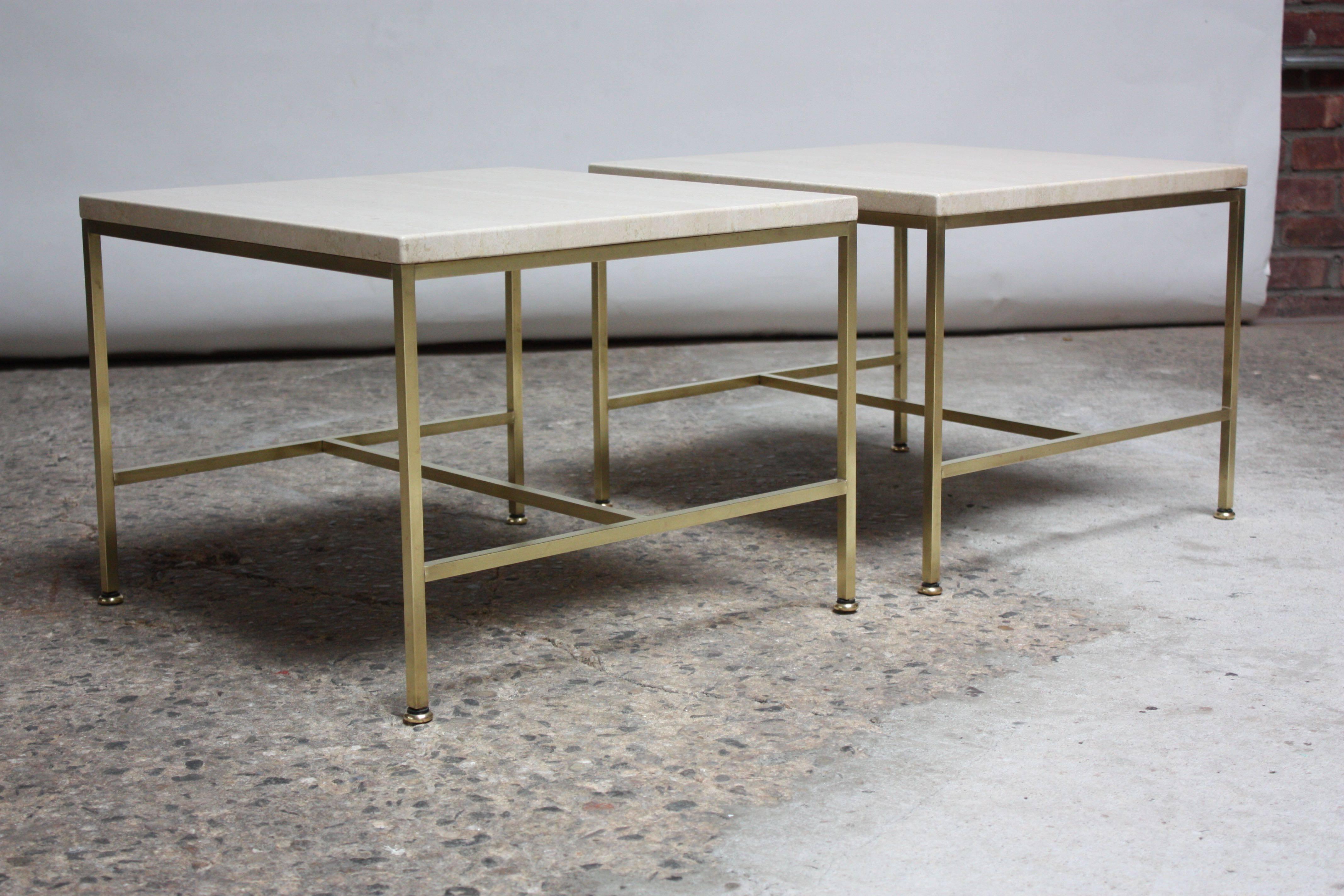 Pair of 1950s Paul McCobb for Directional side / occasional tables composed of tubular brass frames / brass feet and square, travertine tops. Brass is in beautiful, polished condition; showing only minor wear (light spots remain post-buff and polish