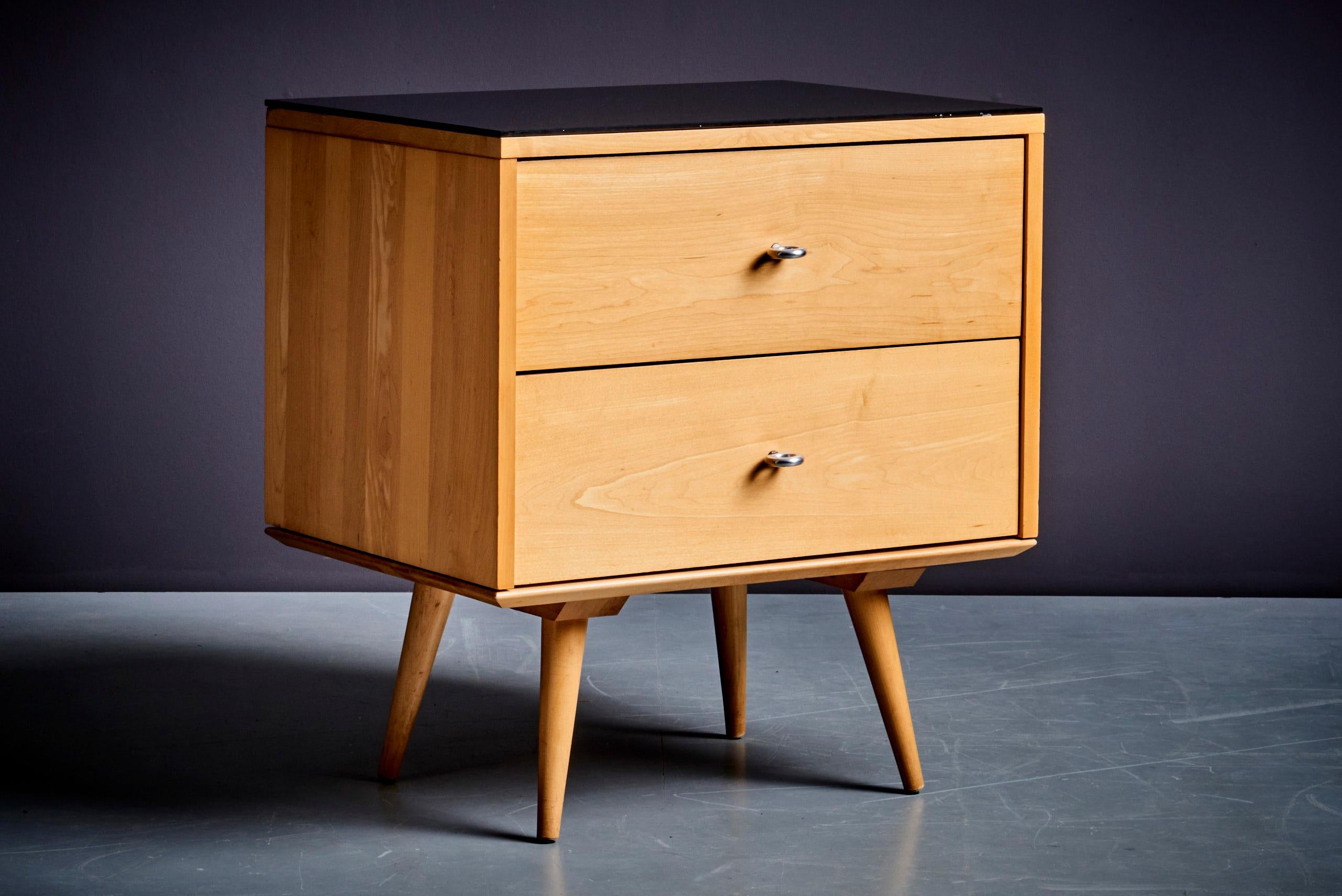 Solid maple and aluminum ring pulls. The drawer is in excellent condition.

