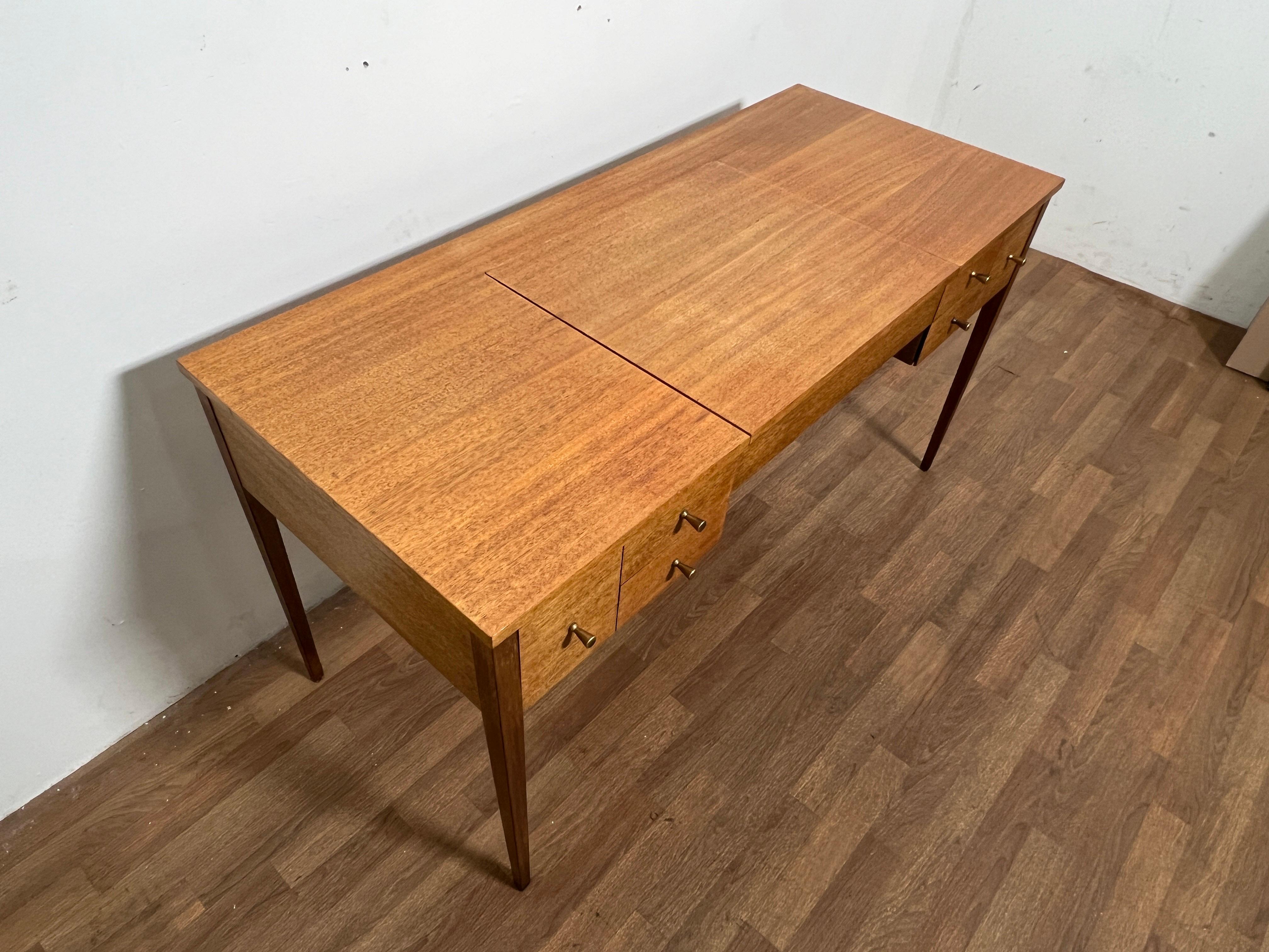 A mid-century modern vanity table in Honduran mahogany by Paul McCobb, for Calvin Furniture, Irwin Collection, circa late 1950s.