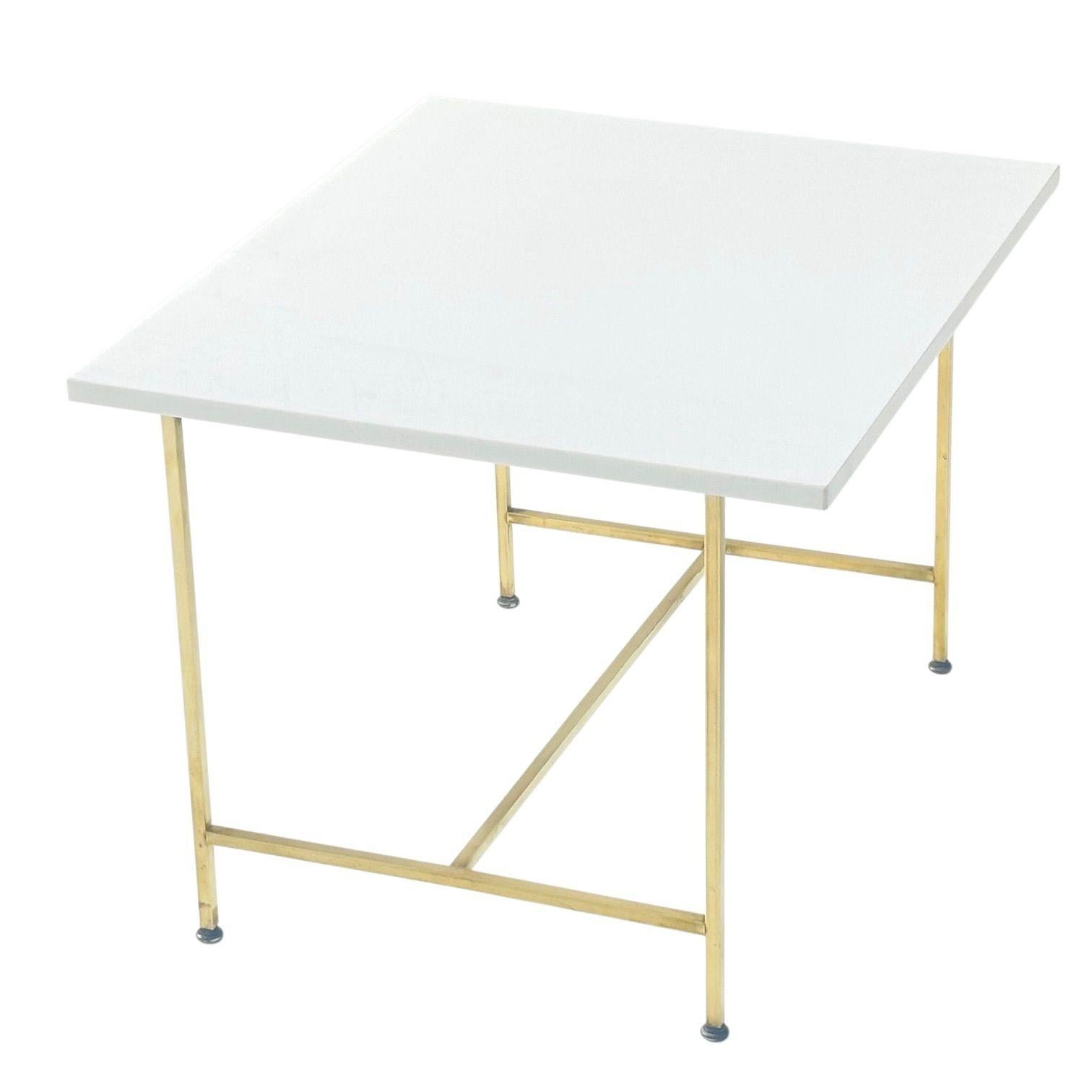 Paul McCobb Vitrolite and Brass Side/End Table, 1960’s.  Original great condition.
Measures 20.5” tall 28” wide 24” deep.