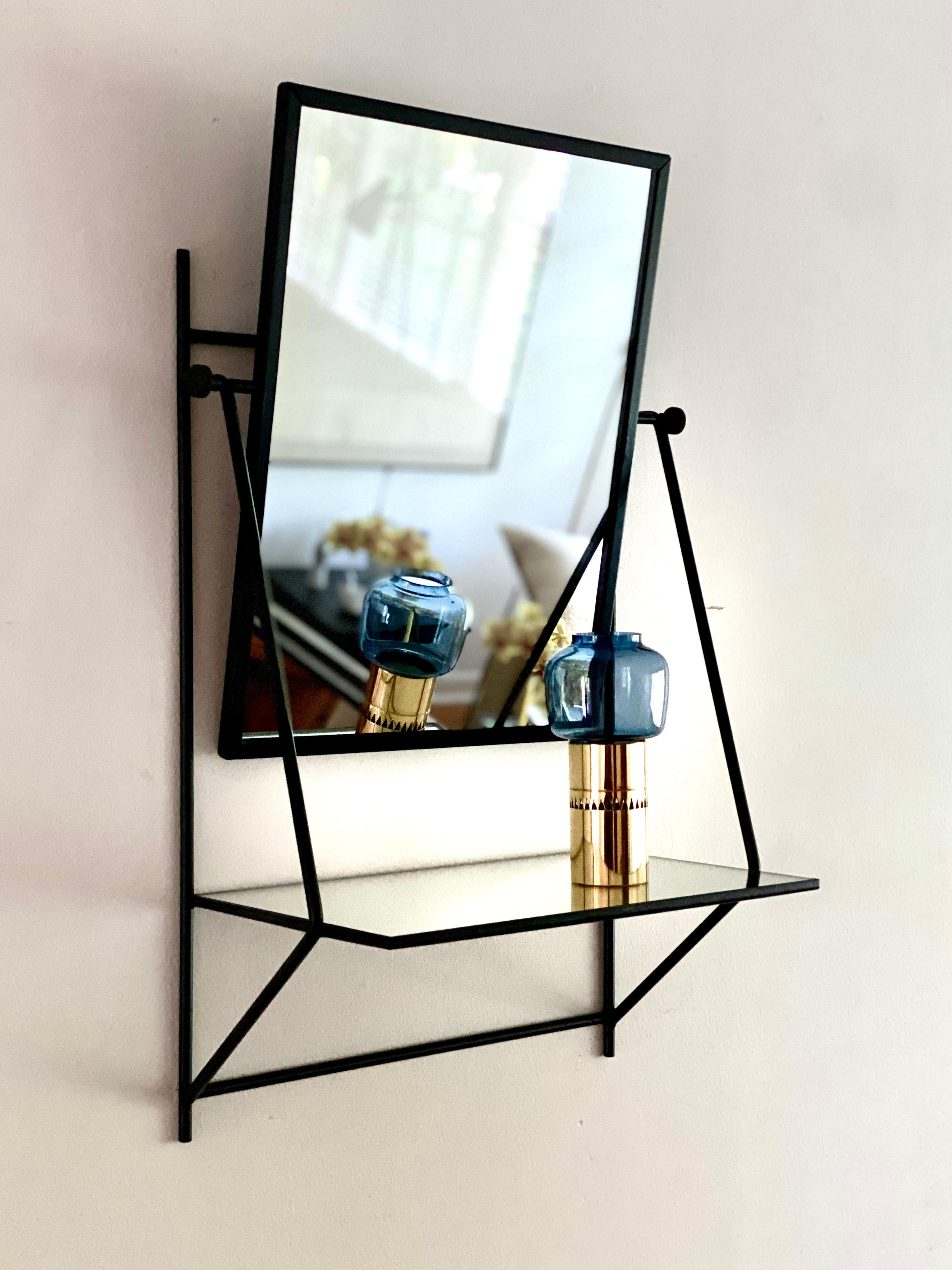 A wall hung mirror / shelf designed by Paul McCobb for Bryce Originals in 1953.  Paul McCobbs designs for Bryce Originals are quite hard to find, this wall hung mirror / shelf design is one of the rarer designs for Bryce Originals.  The piece is
