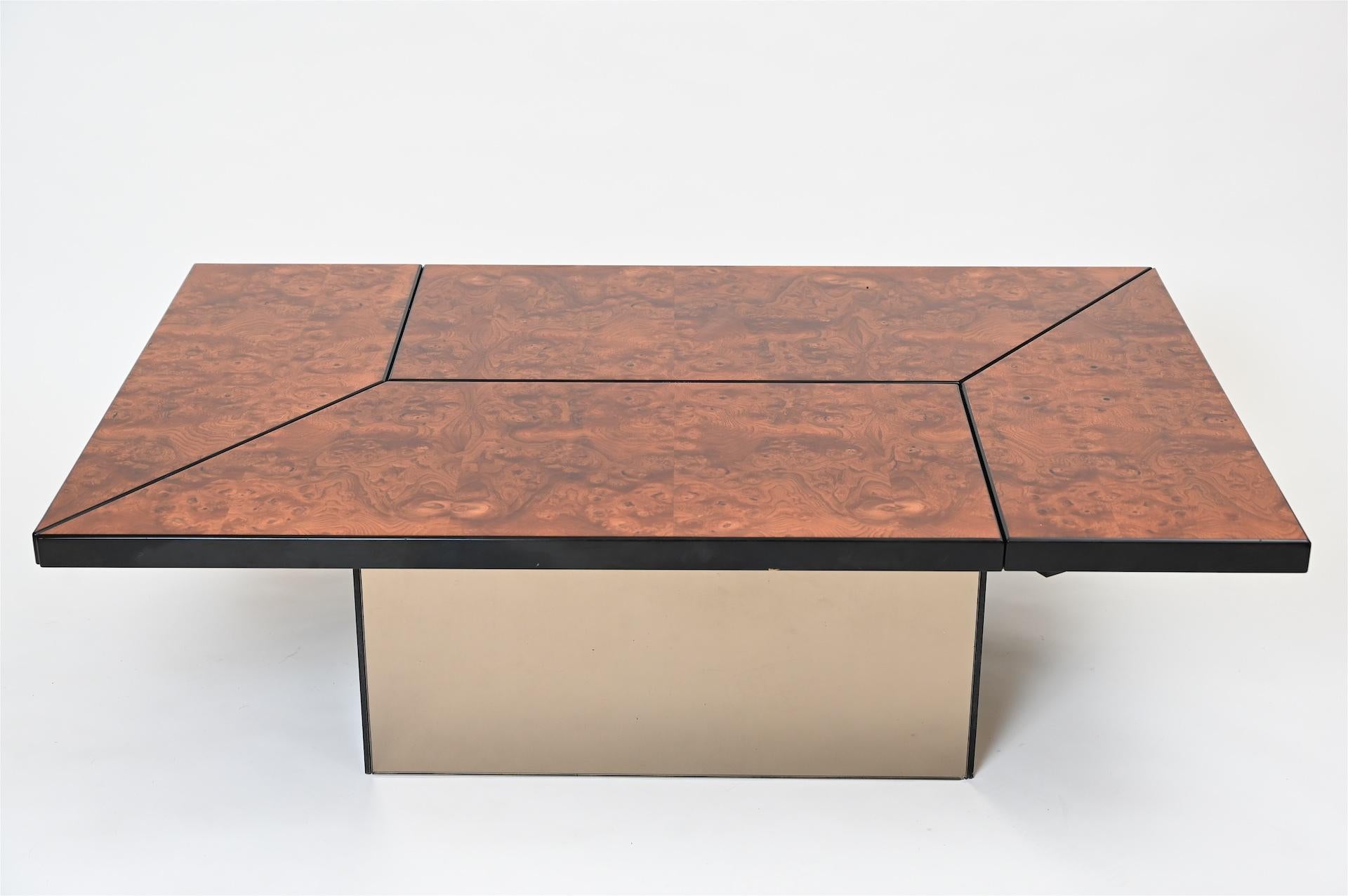 A Paul Michel 1970s and burr walnut and ebonized metamorphic cocktail coffee table. 
Opens to reveal a central mirrored drinks storage section.

In good working order and in excellent condition.