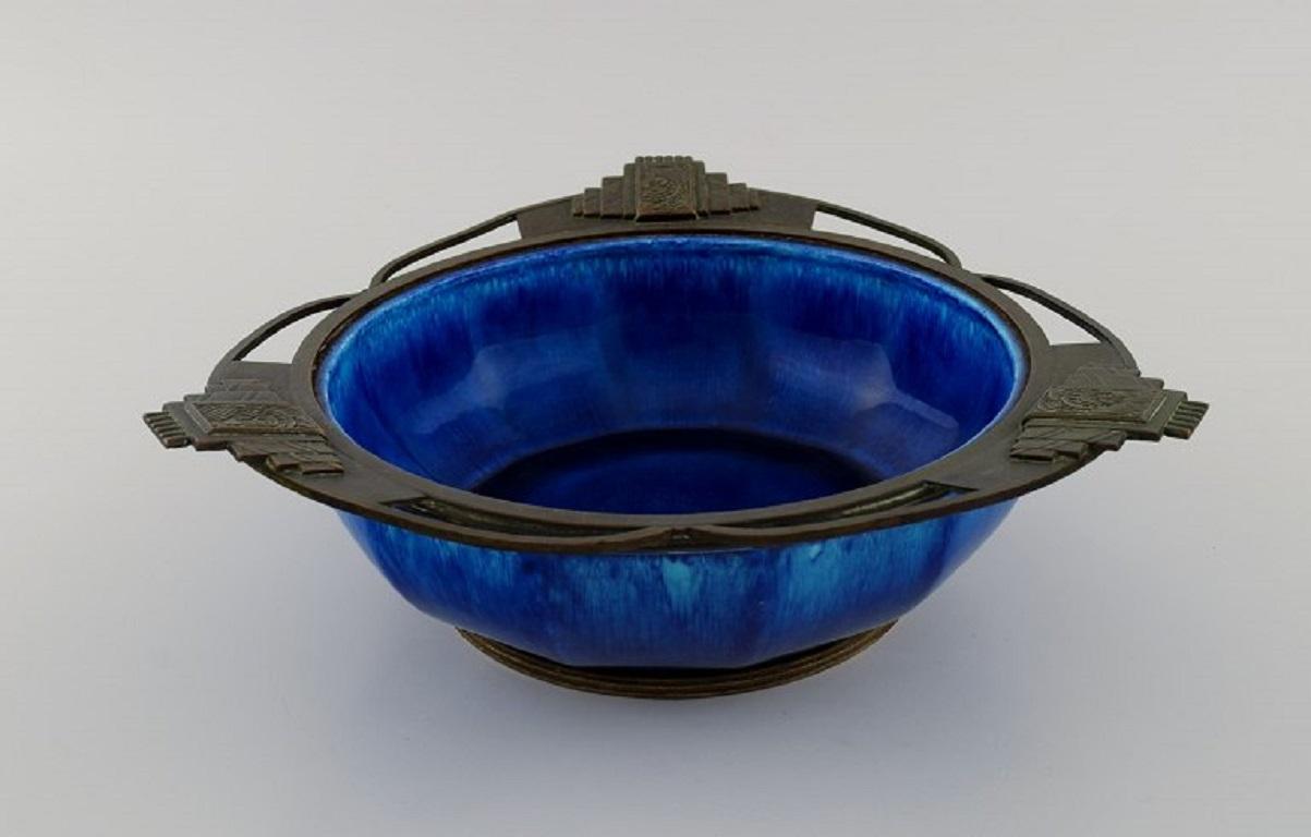Paul Milet (1870-1930) for Sevres, France. 
Art Deco bowl in glazed ceramics with bronze mounting. 
Beautiful glaze in shades of blue. 1930s.
Measures: 25 x 8 cm.
In excellent condition.
Stamped.