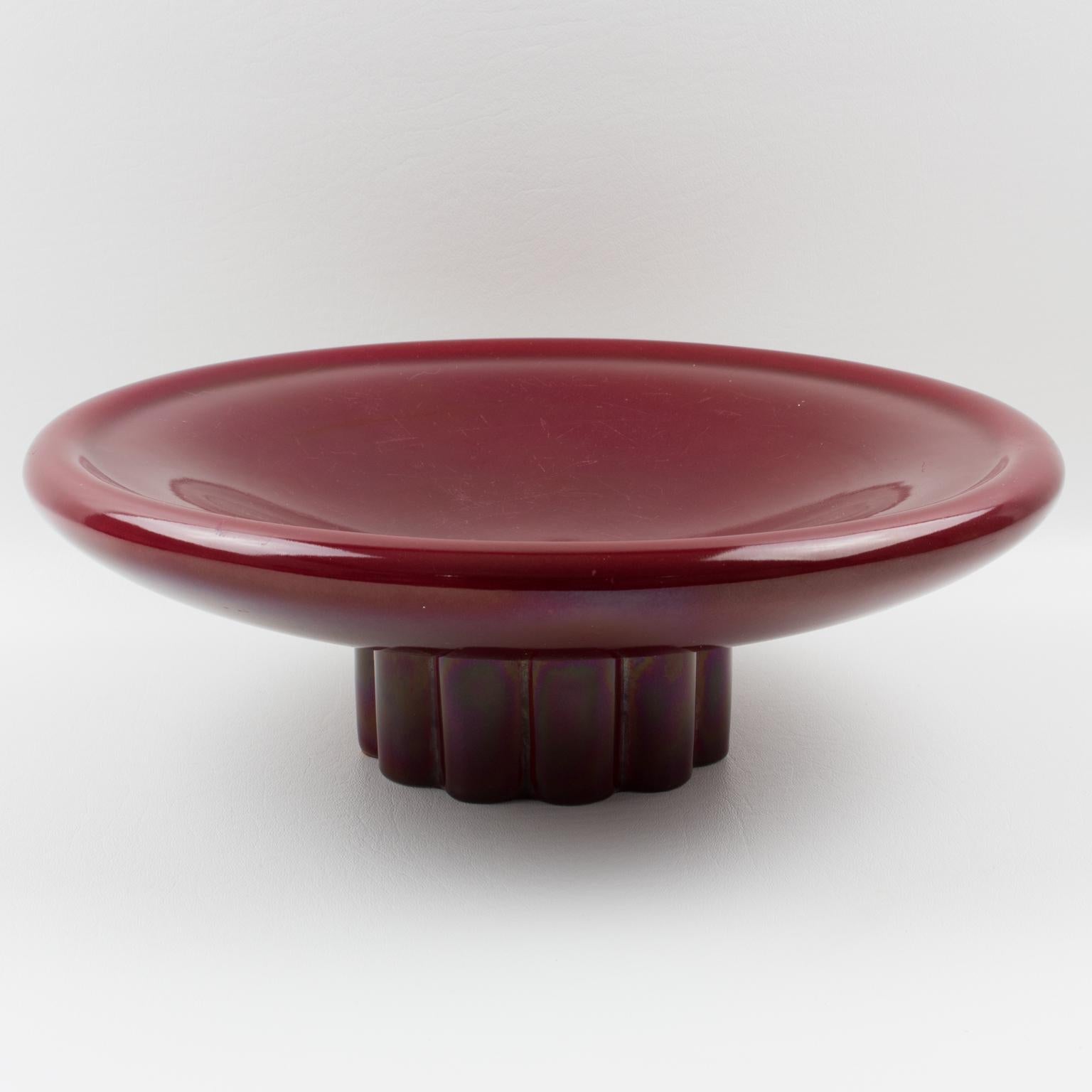 A charming French Art Deco modernist ceramic decorative bowl centerpiece, designed by Paul Milet (1870-1950) for Manufacture de Sevres, France. Large streamline round shape with oxblood red glaze on fluted base. Signed and marked underside: 
