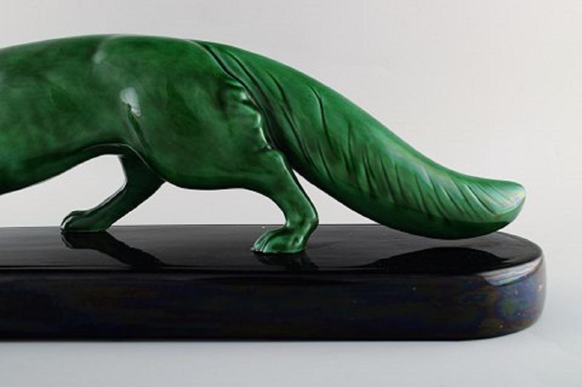 Paul Milet for Sevres, France. Large Art Deco fox in glazed ceramics. Beautiful green glaze, 1920s.
Stamped.
In perfect condition.
Measures: 56 x 18 cm.