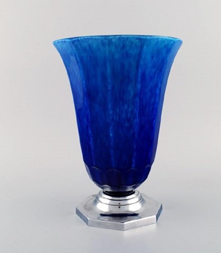 Paul Milet for Sevres, France. Large Art Deco vase in glazed ceramics with stainless steel base. Beautiful glaze in shades of blue, 1930s.
Measures: 27 x 19.5 cm.
In excellent condition.
Stamped.