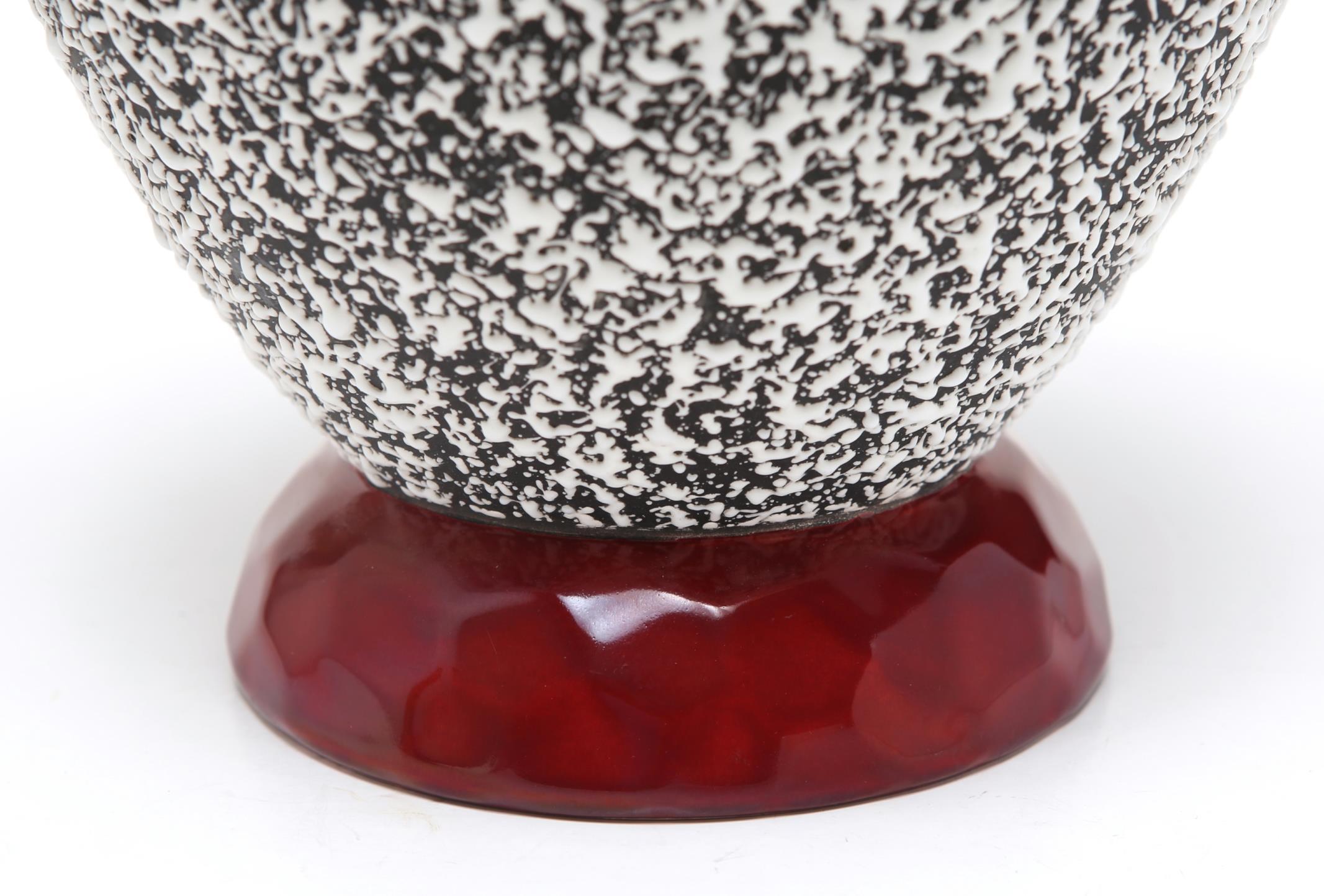French Art Deco globular Sevres ceramic vase designed by Paul Milet in the 1930s. The piece has oxblood red and anthracite gray glazes and an all-over white enamel 